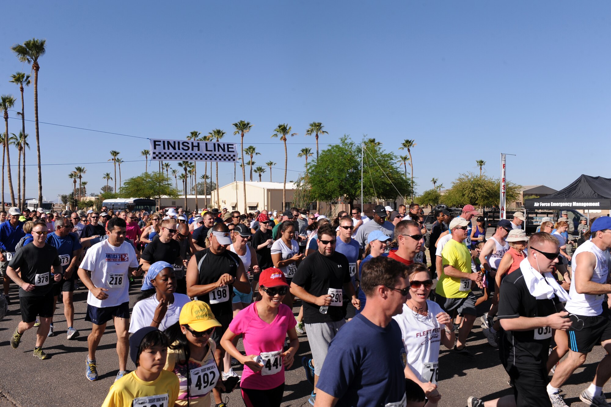 U.S. Active Duty Military and local Tucson residents begin the Desert Boneyard 5K Fun Run/Walk at the start and finish line at the 309th Aerospace Maintenance and Regeneration Group at Davis-Monthan Air Force Base, Ariz., April 27, 2013. Approximately 810 participants from around the local Tucson area registered for the 5K. (U.S. Air Force photo by Airman 1st Class Christine Griffiths/Released)