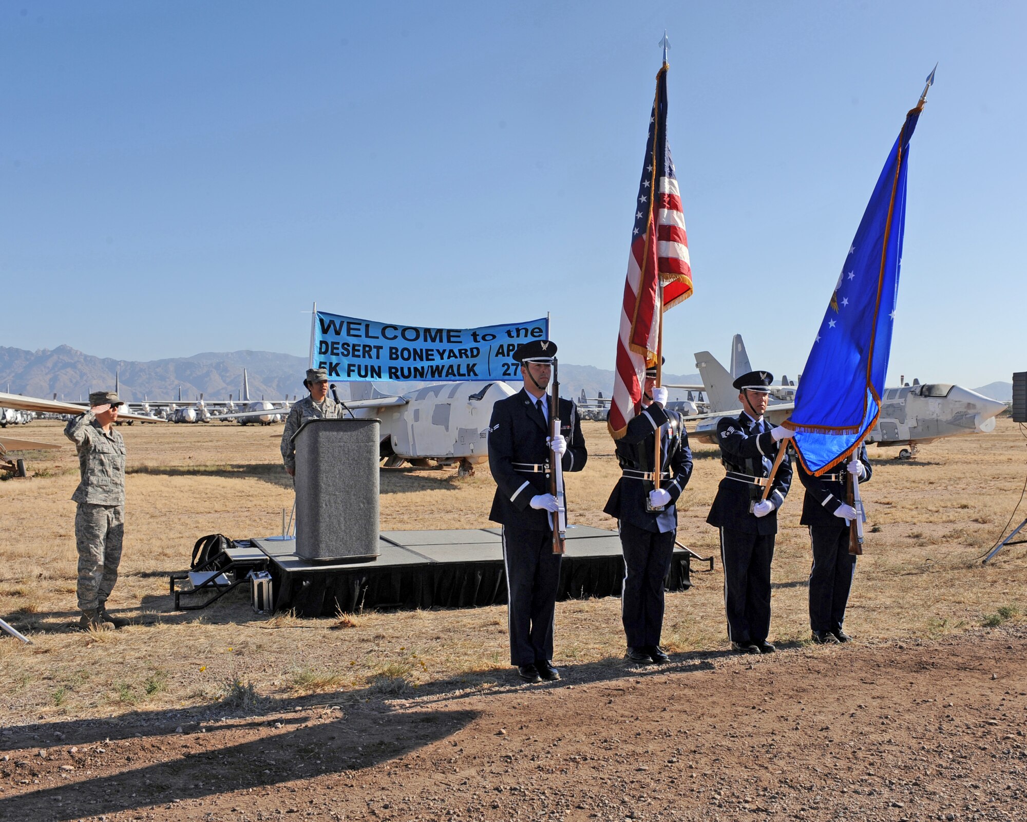 Members of Davis-Monthan Air Force Base Honor Guard post the colors prior to the Desert Boneyard 5K Fun Run/Walk at the The 309th Aerospace Maintenance and Regeneration Group at Davis-Monthan Air Force Base, Ariz., April 27, 2013. Approximately 810 participants from around the local Tucson area registered for the 5K. (U.S. Air Force photo by Airman 1st Class Christine Griffiths/Released)