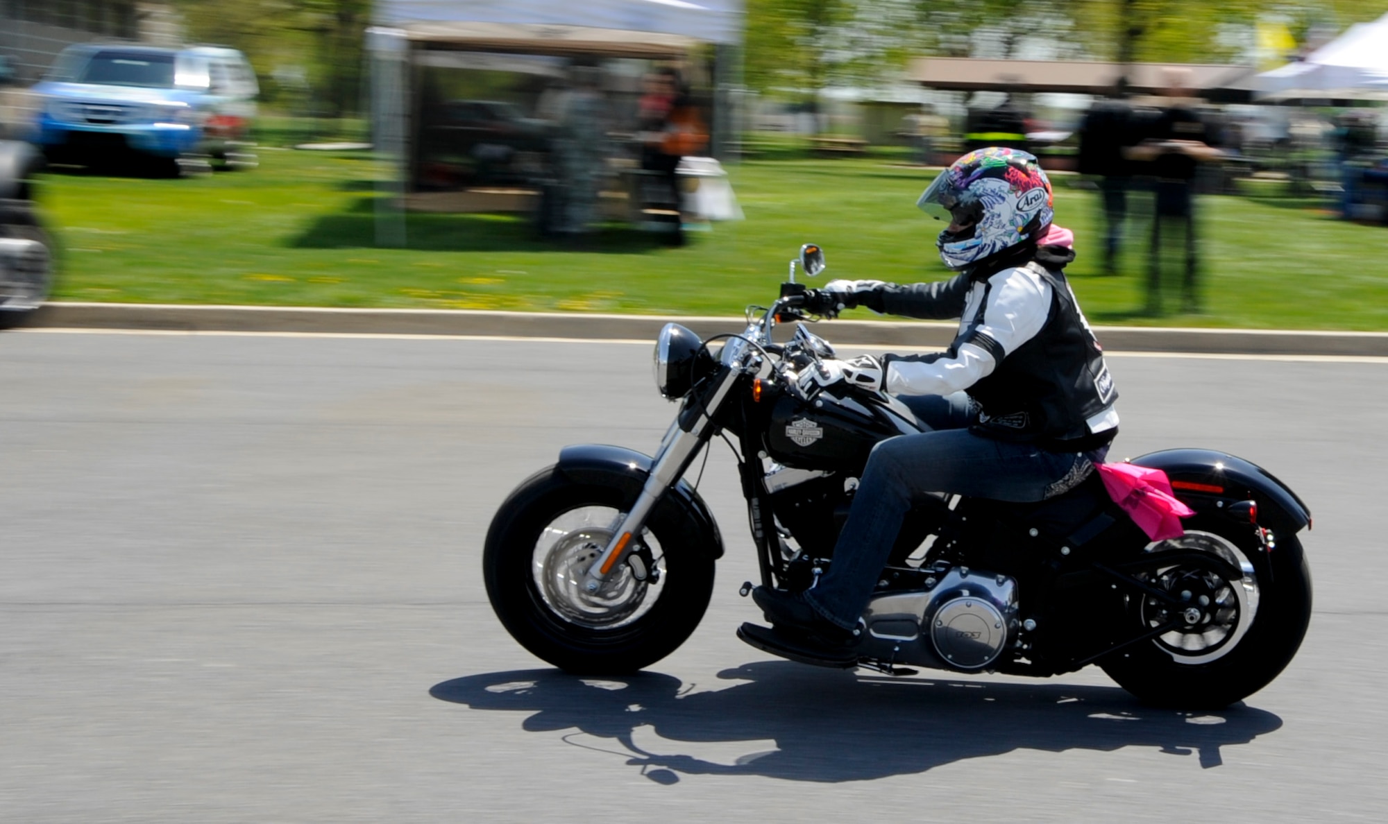 A participant of Motorcycle Safety Day taking advantage of cruise on one of the motorcycles provided at Motorcycle Safety Day April 26, 2013, Dover Air Force Base, Del. The 436th Airlift Wing Safety team put together the 8th Annual Motorcycle Safety Day to help combat the loss or life and limb for Dover AFB. (U.S. Air Force photo/Senior Airman Jared Duhon)
