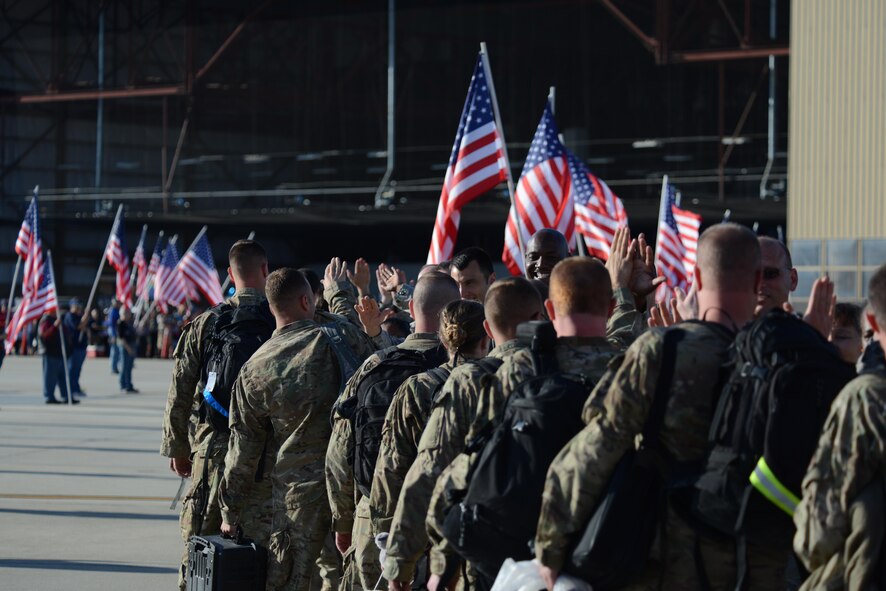 Airmen assigned to the 77th Fighter Squadron are greeted by 20th Fighter Wing leadership and the South Carolina Patriot Guard, as they arrive at Shaw Air Force Base, S.C., April 25, 2013. More than 400 friends, family members, co-workers and supervisors greeted approximately 100 Airmen returning from a six-month deployment in Afghanistan. (U.S. Air Force photo by Master Sgt. Cohen A. Young/Released)