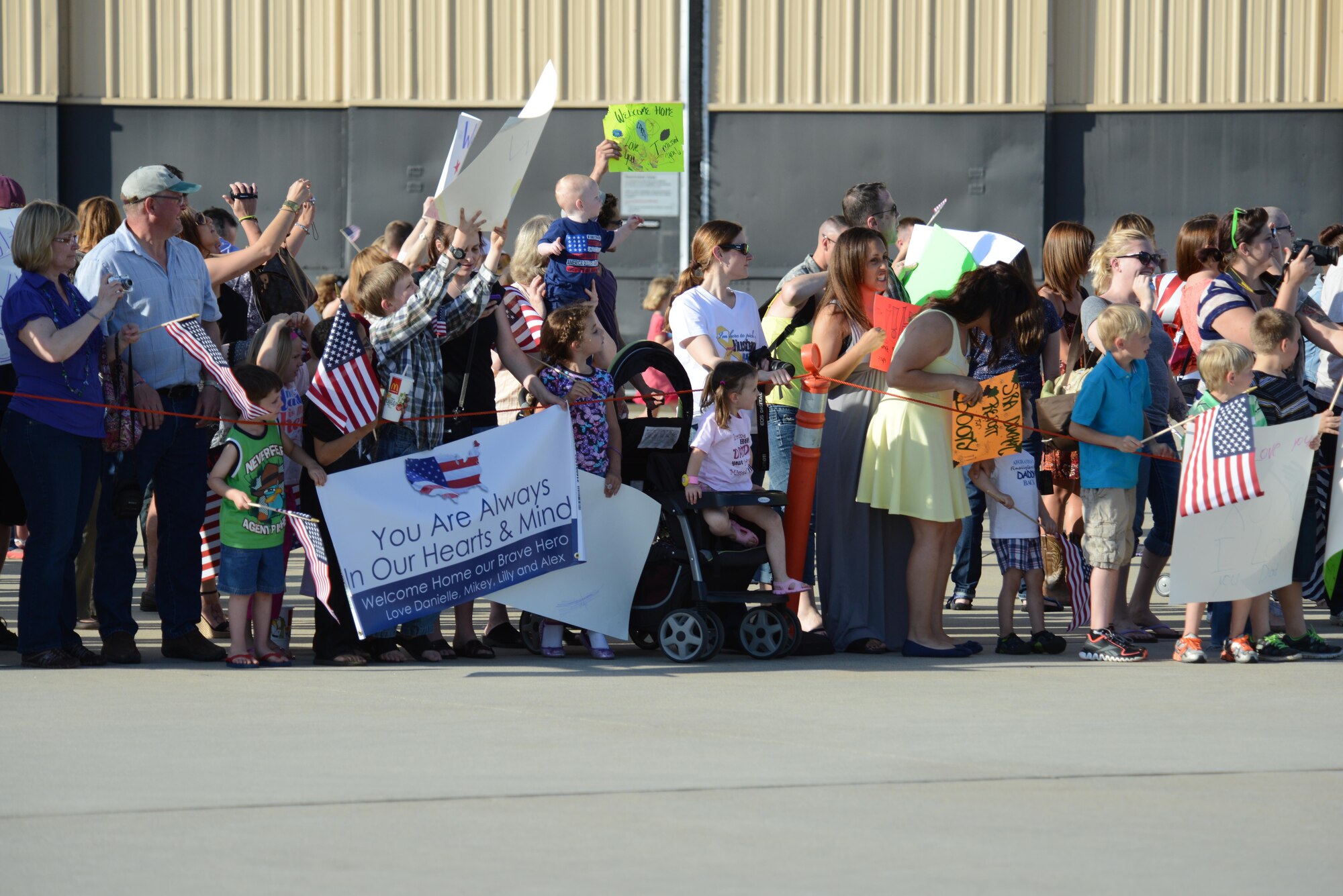 More than 400 friends, family members, co-workers and supervisors anxiously await approximately 100 Airmen assigned to the 77th Fighter Squadron who returned to Shaw Air Force Base, S.C., April 25, 2013, after a six-month deployment in Afghanistan. (U.S. Air Force photo by Master Sgt. Cohen A. Young/Released)