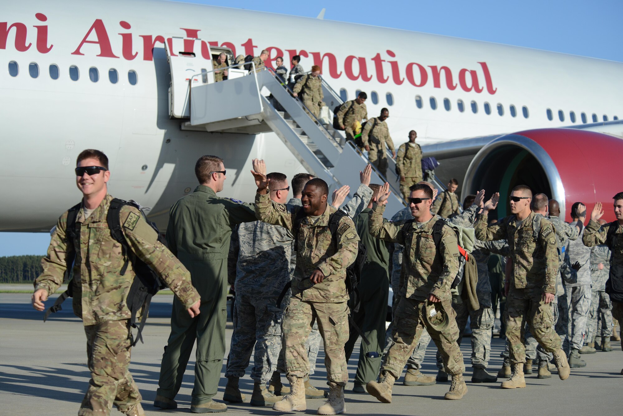 More than 400 friends, family members, co-workers and supervisors anxiously await approximately 100 Airmen assigned to the 77th Fighter Squadron who returned to Shaw Air Force Base, S.C., April 25, 2013, after a six-month deployment in Afghanistan. (U.S. Air Force photo by Master Sgt. Cohen A. Young/Released)