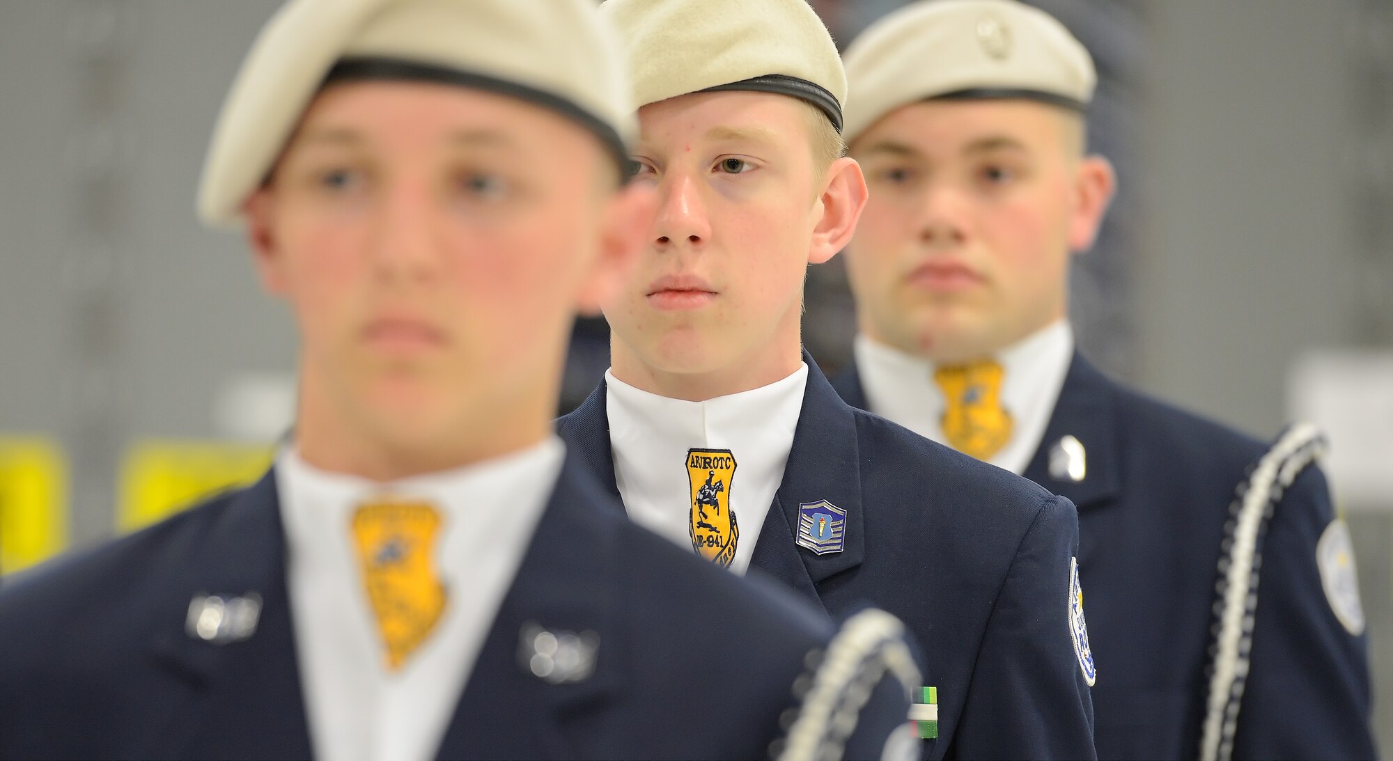 Cadet Master Sgt. Cory Hill, 16, center, is framed by Master Sgt. Chandler Jackson, 16, foreground, and Col. Ben Lewis, 17, background, during a unit drill competition event, April 20, 2013 at Dover Air Force Base, Del. The cadets are from AF JROTC unit 941, Caesar Rodney High School, Camden, Del. and are participating in the 2013 Junior Reserve Officer Training Corps drill competition. The 436th Logistics Readiness Squadron, 436th Airlift Wing,Dover AFB hosted the competition.   (U.S. Air Force photo/Greg L. Davis)