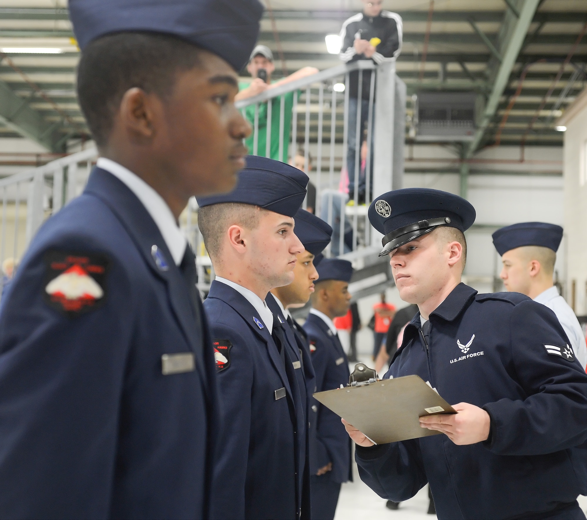 Airman 1st Class Daniel Mayfield, 436th Logistics Readiness Squadron, vehicle operations section, inspects the appearance and uniform of Air Force Junior Reserve Officer Training Corps Cadet Second Lieutenant Nicolas Hillman, William Penn High School during the Air Force Junior Reserve Officer Training Corps (JROTC) drill competition, April 20, 2013 at Dover Air Force Base, Del. The 436th Logistics Readiness Squadron, 436th Airlift Wing,Dover AFB hosted the event.  (U.S. Air Force photo/Greg L. Davis)