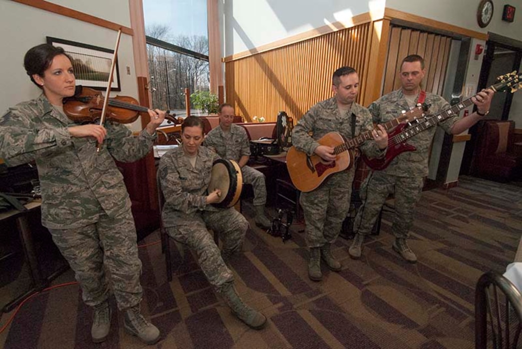 Members of The U.S. Air Force Band’s Celtic Aire perform during a special Deployed Spouses Meal at Freedom Hall Dining Facility on Joint Base Andrews, Md. April 6, 2013. The free meal was held in honor of family members of deployed service members and included music, a face painting station and a visit from McGruff the Crime Dog, the National Crime Prevention Council’s crime-prevention bloodhound character. (Photo/Bobby Jones)