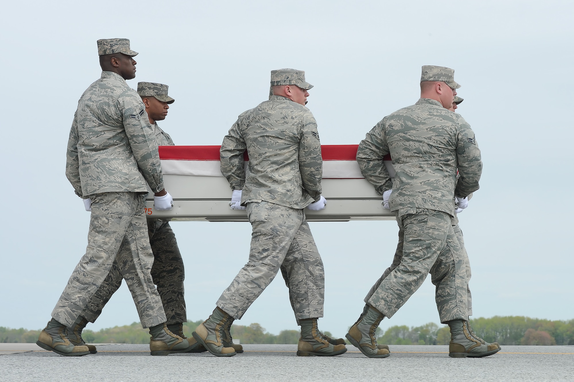 A U.S. Air Force carry team transfers the remains of Staff Sgt. Daniel N. Fannin, of Morehead, Ky., during a dignified transfer April 30, 2013 at Dover Air Force Base, Del. Fannin was assigned to the 552nd Operations Support Squadron, Tinker AFB, Okla. (U.S. Air Force photo/Greg L. Davis)