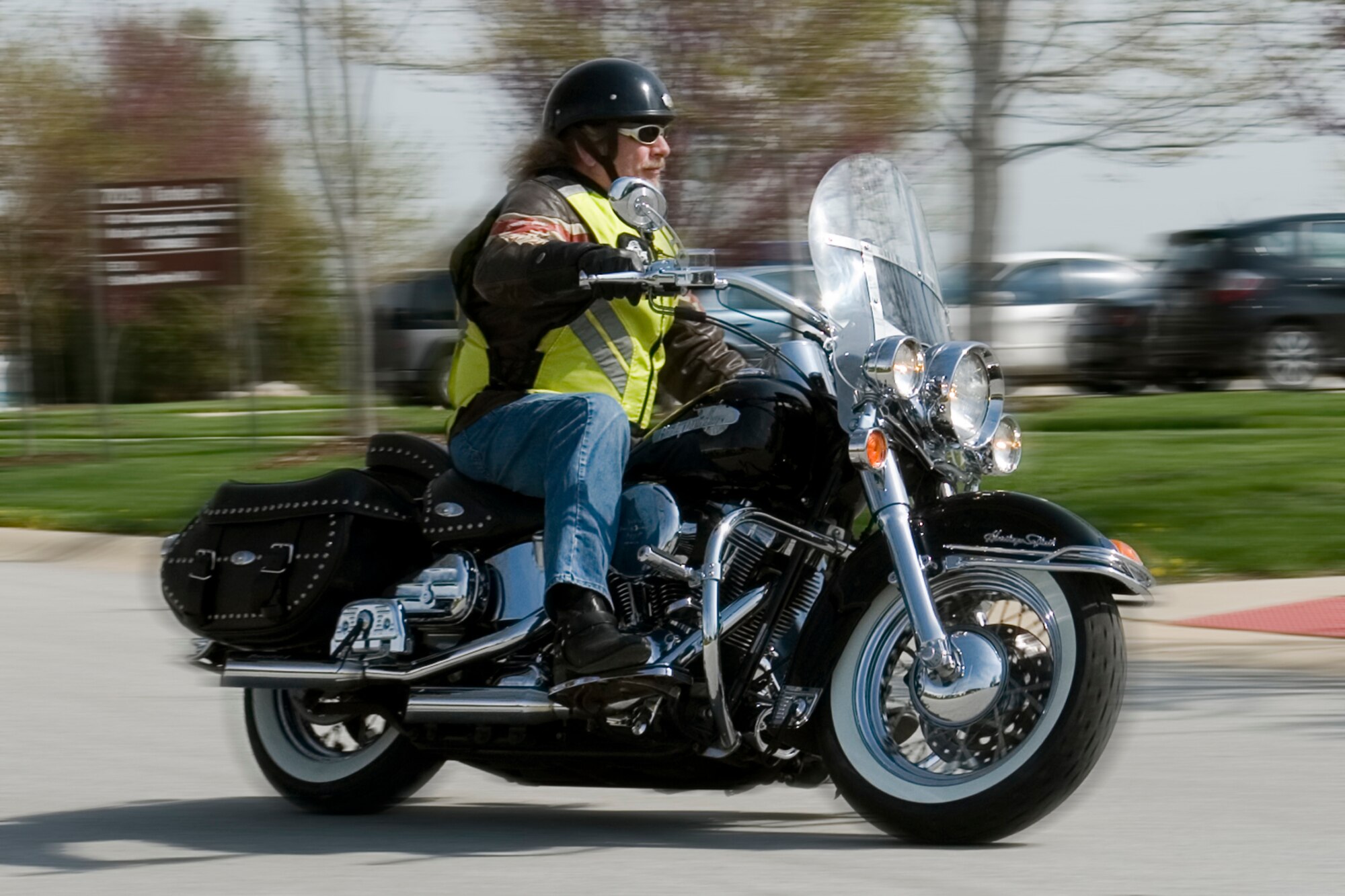 GRISSOM AIR RESERVE BASE, Ind. -- Mike Thompson, 434th Communications Squadron radar maintenance technician, drives his motorcycle on base April 30. Motorcycle riders at Grissom are required to wear the proper safety equipment, attend a safety briefing and undergo a safety course offered by Indiana's American Bikers Aimed Toward Education, which offers courses throughout the state. (U.S. Air Force photo illustration/Senior Airman Andrew McLaughlin)