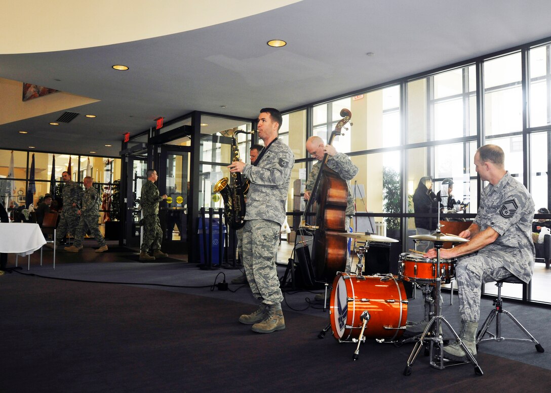 Guests entering and exiting the Wounded Warrior Café at Walter Reed National Military Center in Bethesda, Md. are serenaded by members of The U.S. Air Force Band’s Airmen of Note April 4, 2013. Playing an hour set for Wounded Warriors at the center is part of The U.S. Air Force Band’s latest outreach initiative. (U.S. Air Force photo/Senior Airman Lindsey A. Porter)