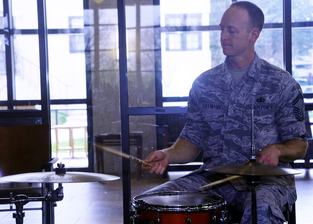 Senior Master Sgt. Dennis Hoffmann, drummer with The U.S. Air Force Band, plays for Wounded Warriors inside the Wounded Warrior Café at Walter Reed National Military Center in Bethesda, Md. April 4, 2013. Members of the Airmen of Note, along with numerous other band ensembles, perform for Wounded Warriors at the café on a rotating monthly basis. (U.S. Air Force photo/Senior Airman Lindsey A. Porter)