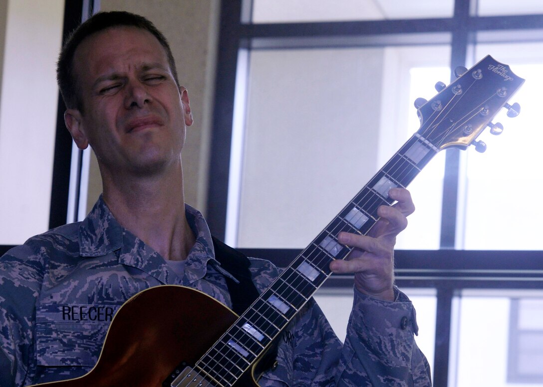 Tech. Sgt. Geoffrey Reecer, guitarist with The U.S. Air Force Band, plays for Wounded Warriors at the Wounded Warrior Café at Walter Reed National Military Center in Bethesda, Md. April 4, 2013. Members from the Airmen of Note and other band ensembles perform for Wounded Warriors at the café throughout the year.  (U.S. Air Force photo/Senior Airman Lindsey A. Porter)
