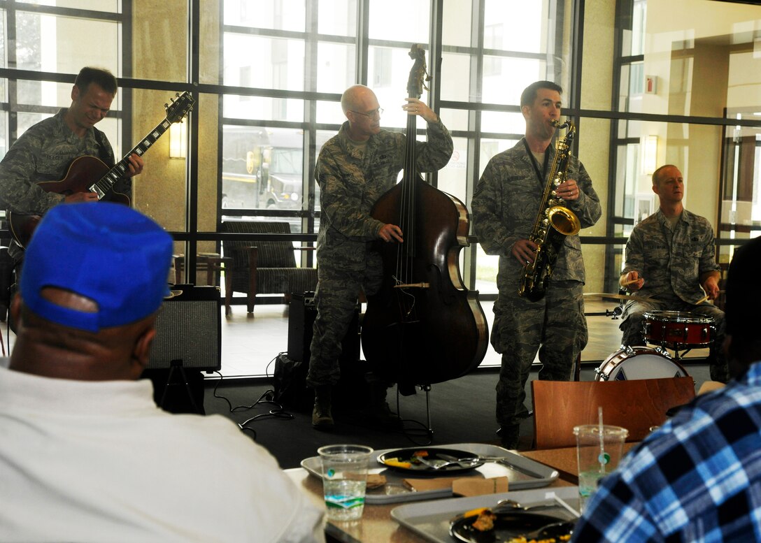 Patrons to the Wounded Warrior Café at Walter Reed National Military Center in Bethesda, Md. take a break from lunch to hear music by The U.S. Air Force Band’s Airmen of Note April 4, 2013. This quartet along with other groups within the band to include Celtic Aire and a string quartet play for Wounded Warriors at the café on a monthly rotating basis. (U.S. Air Force photo/Senior Airman Lindsey A. Porter)