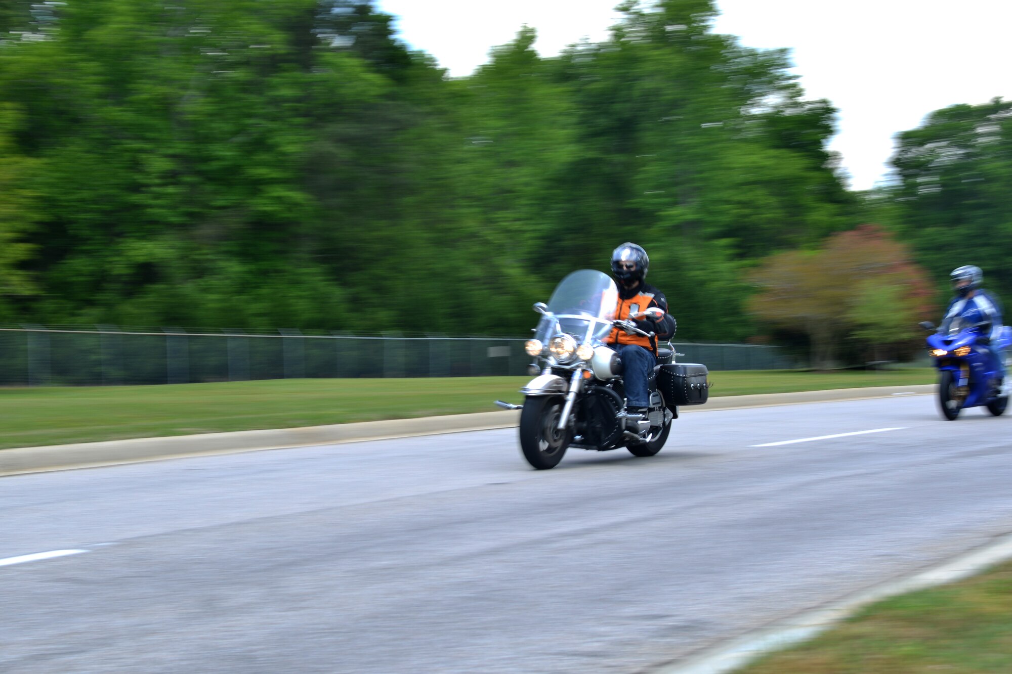 A motorcyclist takes on the road for a motorcycle safety ride, Shaw Air Force Base, S.C., April 26, 2013. The safety ride was one of the activities for the Comprehensive Airmen Fitness day held on base. (U.S Air Force photo by Airman 1st Class Ashley L. Gardner/Released)
