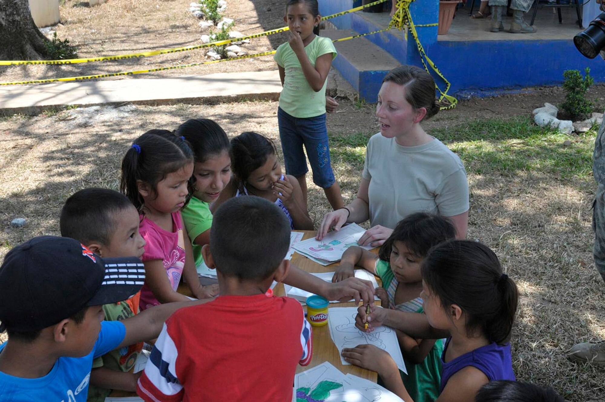 U.S. Air Force Staff Sgt. Sally Simms, with the 59th Medical Wing based at Joint Base San Antonio-Lackland, Texas, takes a break to spend time with children during the Beyond the Horizon medical readiness training exercise at Cerro De Plata, Panama, April 16, 2013. The MEDRETE focused on working alongside Panamanian personnel to provide free health care to the people of Cerro De Plata, Los Valles and Calobre. Beyond the Horizon is a chairman of the Joint Chiefs of Staff-directed, U.S. Southern Command-sponsored joint and combined field training humanitarian exercise. (U.S. Army photo by/1st. Lt. Harold Williams)