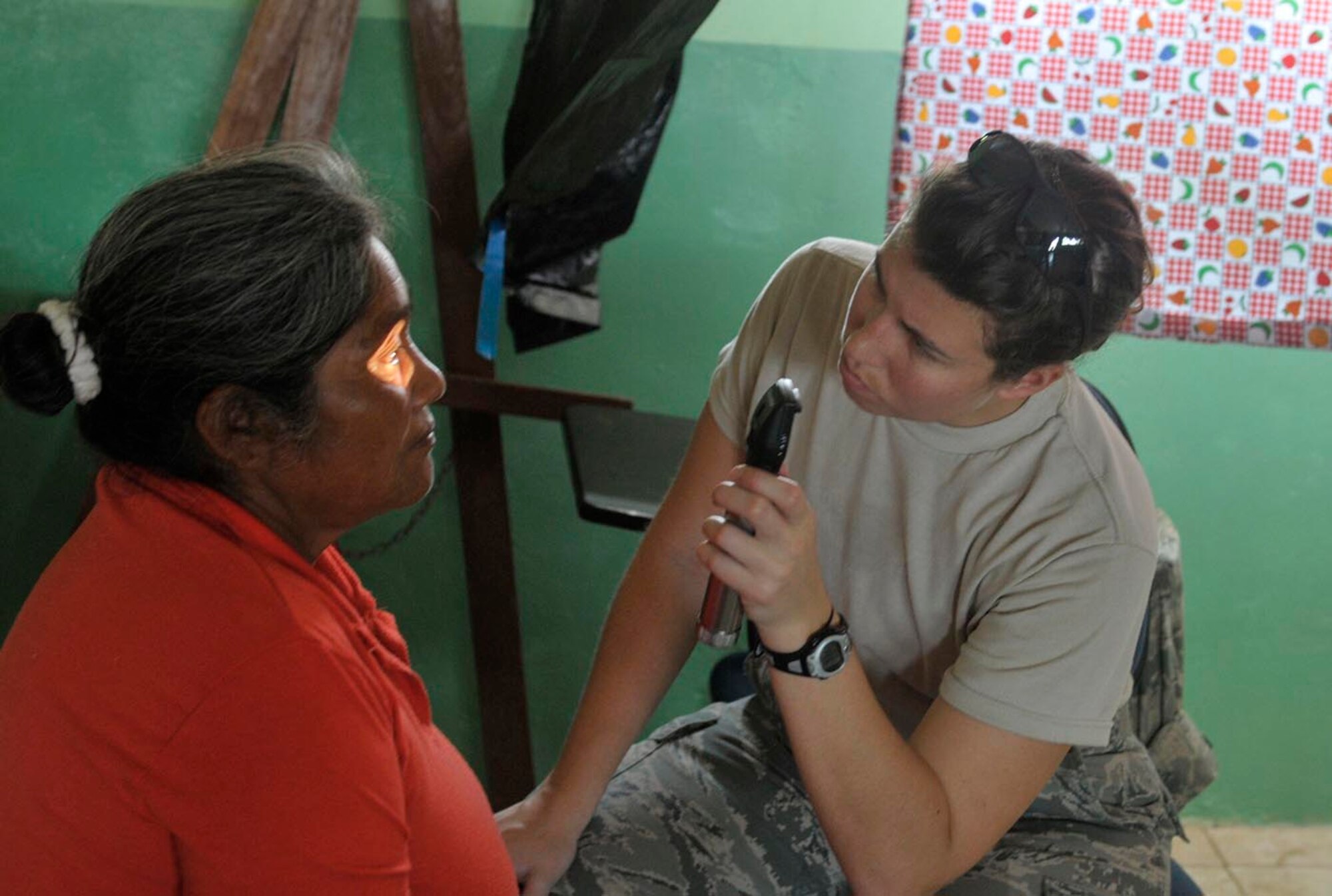 U.S. Air Force Capt. Nikki Lagendyk, an obstetrician with the 59th Medical Wing based at Joint Base San Antonio-Lackland, Texas, performs an eye exam on a Panamanian patient during a medical readiness training exercise for Beyond the Horizon in Veraguas, Panama, April 16, 2013. Beyond the Horizon is a chairman of the Joint Chiefs of Staff-directed, U.S. Southern Command-sponsored joint and combined field training humanitarian exercise. (U.S. Army photo by/1st. Lt. Harold Williams)
