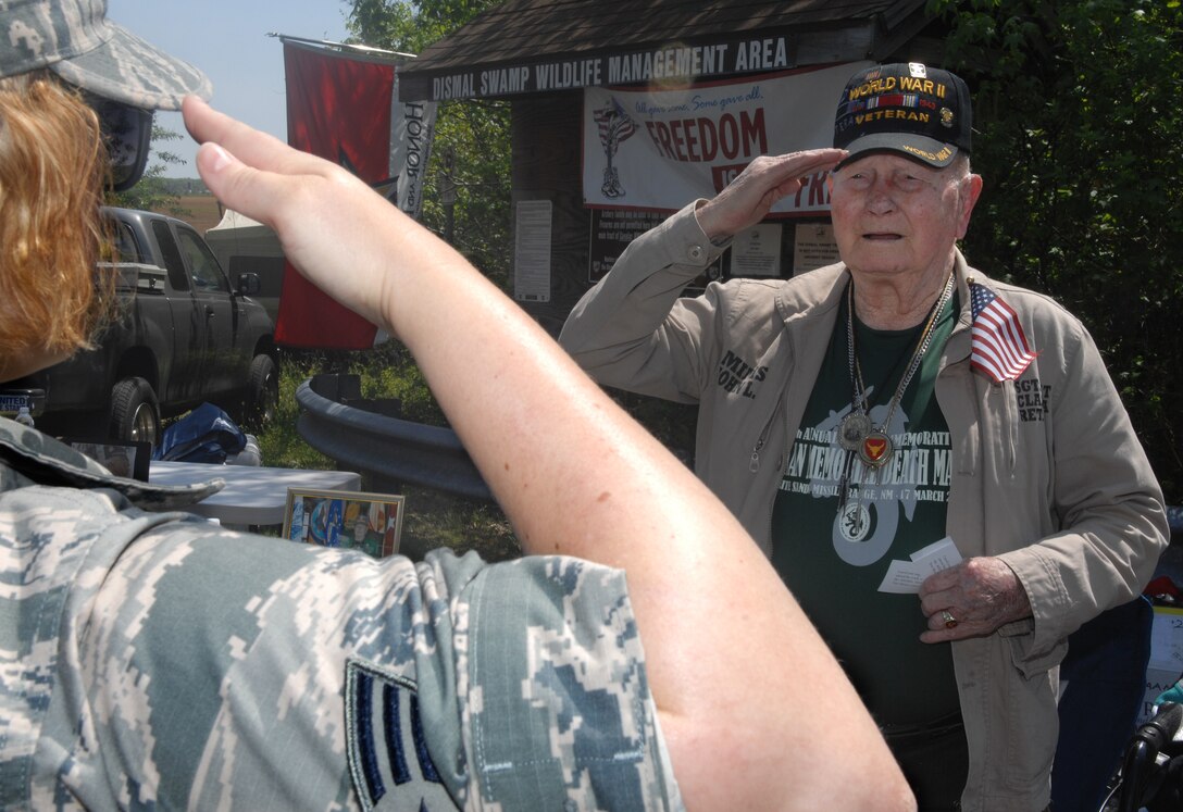 John Mims, a Bataan Death March survivor, salutes an Airman after the Bataan Death March memorial walk at Chesapeake, Va., April 27, 2013. Approximately 150 Airmen showed up for the walk, and the majority wore their uniforms to better emulate the experience endured by veterans during the Bataan Death March. (U.S. Air Force photo by Airman 1st Class Austin Harvill/Released)