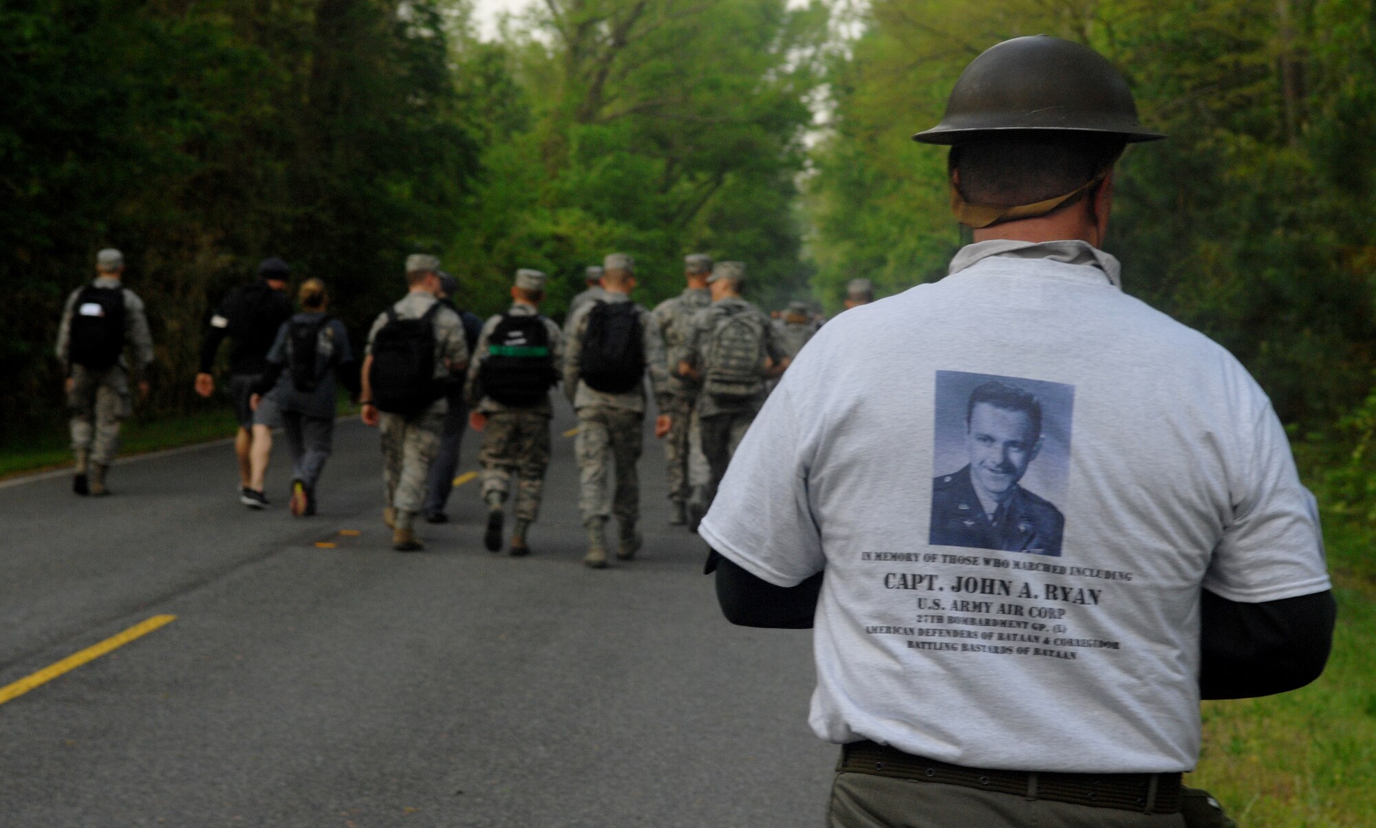 A relative of U.S. Army Air Corps Capt. John Ryan, a veteran killed during the Bataan Death March, walks the 16.6-mile Bataan Death March memorial walk at Chesapeake, Va., April 27, 2013. During the ceremony after the walk, veterans had an opportunity to speak about their experience from the original Bataan Death March. (U.S. Air Force photo by Airman 1st Class Austin Harvill/Released)