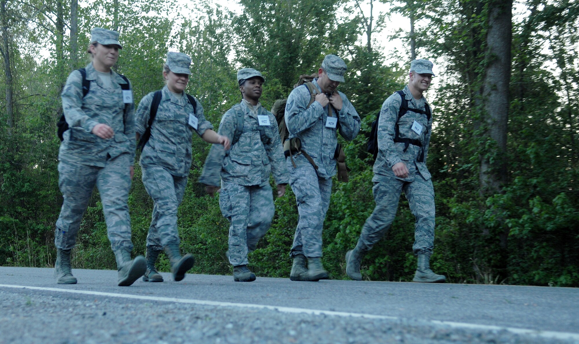 Members from the 633rd Medical Group stick together during the 16.6-mile Bataan Death March memorial walk at Chesapeake, Va., April 27, 2013. Most Airmen wore their uniform for the walk to better emulate the experience endured by veterans before them. (U.S. Air Force photo by Airman 1st Class Austin Harvill/Released)