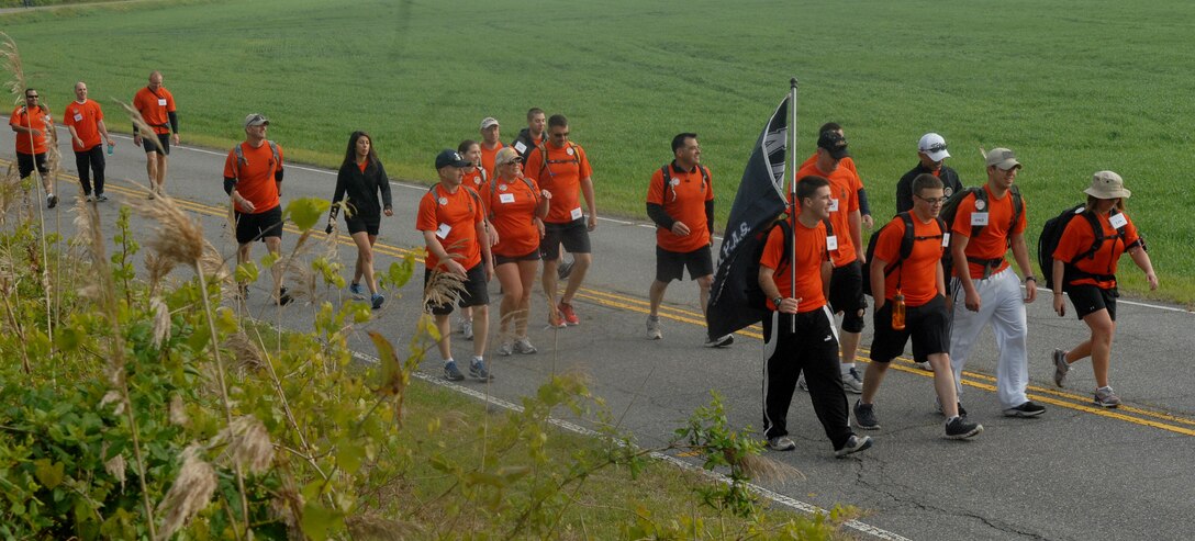 The 1st Maintenance Squadron ammo shop nears the halfway point of the 16.6-mile Bataan Death March memorial walk at Chesapeake, Va., April 27, 2013. Participants embarked on the walk in honor of those who walked in the original Bataan Death March in April, 1942. (U.S. Air Force photo by Airman 1st Class Austin Harvill/Released)