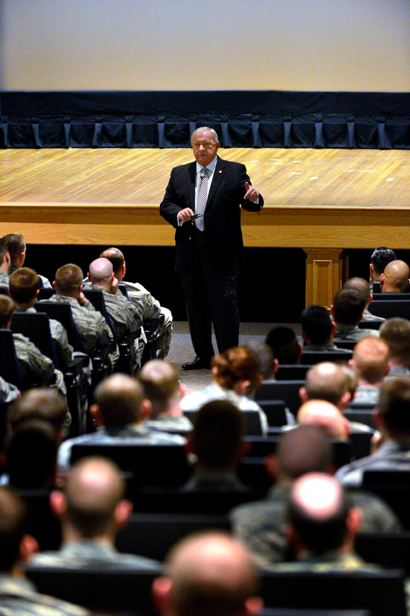 Retired Chief Master Sgt. of the Air Force James C. Binnicker speaks to Team Dover April 26, 2013, at Dover Air Force Base, Del. Binnicker spoke about his life experiences in the Air Force and how he advanced to the rank of Chief Master Sgt. of the Air Force. (U.S. Air Force photo/David S. Tucker)