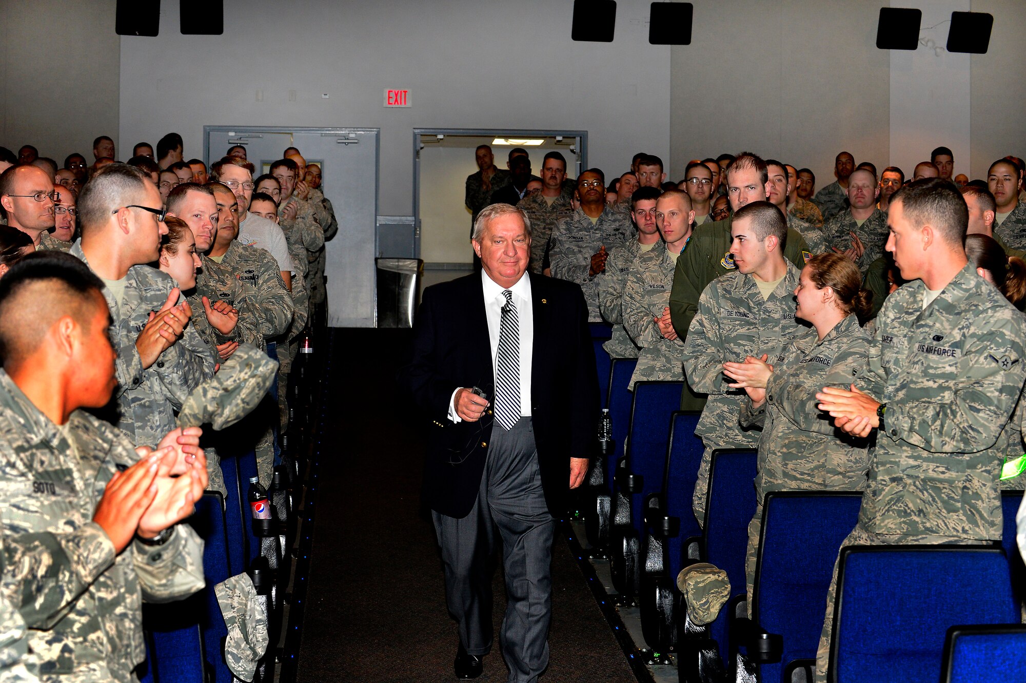 Retired Chief Master Sgt. of the Air Force James C. Binnicker enters the base theater April 26, 2013, at Dover Air Force Base, Del. Binnicker spoke to the Airmen at Dover AFB about various topics including his career and how to ensure success by taking care of your people. (U.S. Air Force photo/David S. Tucker)