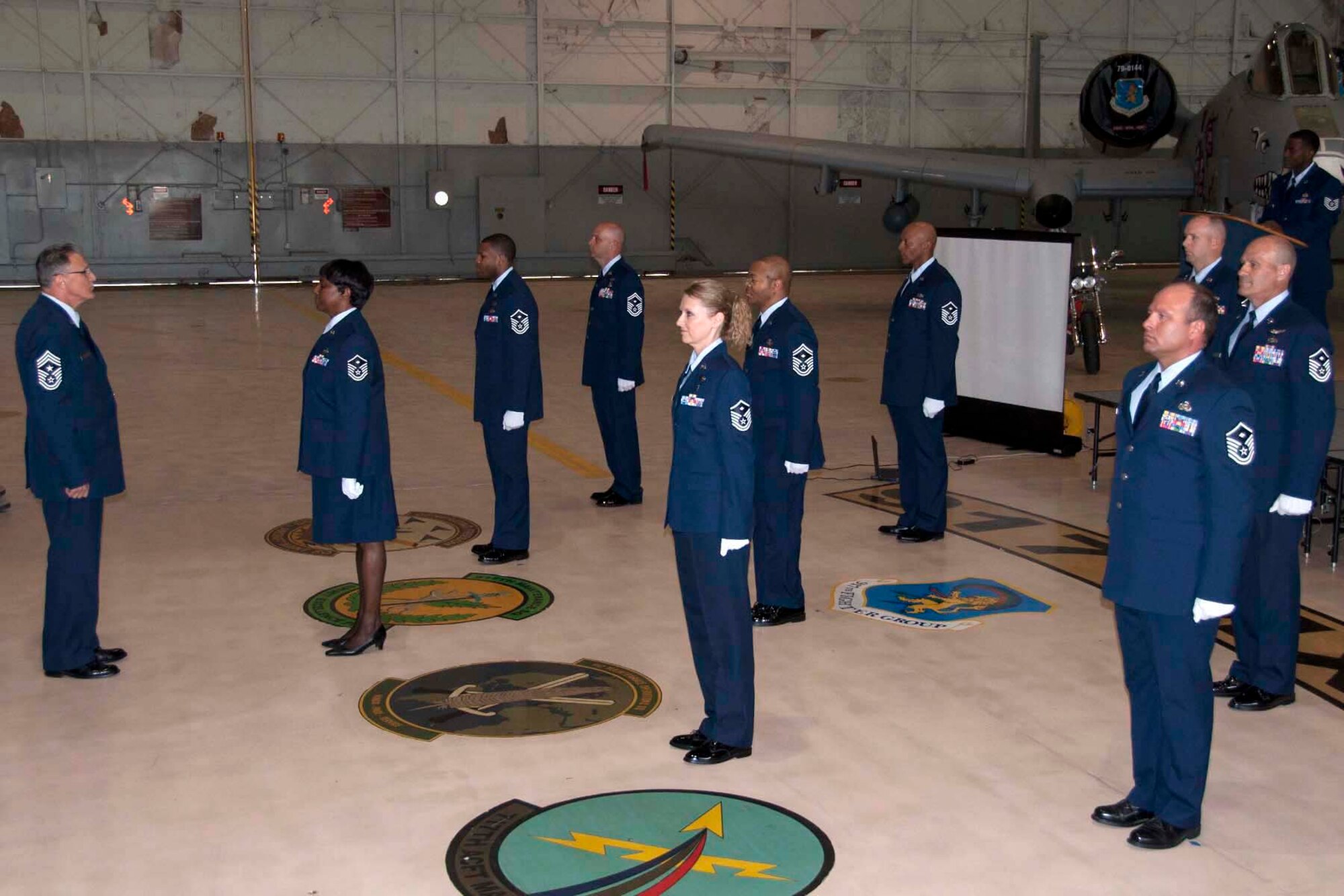 U.S. Air Force Chief Master Sgt. Keith St. Aubin, the 307th Bomb Wing’s Command Chief Master Sgt., laughs as he tries on an apron given to him as a gift during his retirement ceremony at Barksdale Air Force Base, La., April 27, 2013.  St. Aubin, an avid Cajun cook, served in both the U.S. Army and the U.S. Air Force.  His career spanned more than thirty years. (U.S. Air Force photo by Tech. Sgt. Ted Daigle/Released)