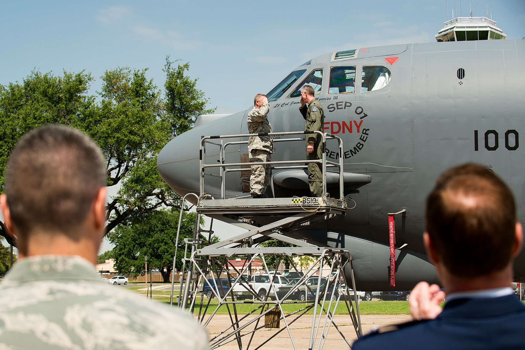 U.S. Air Force Lt. Col. Trey Morriss (right), 93rd Bomb Squadron commander, salutes Master Sgt. Brandon Smith after unveiling his name on the side of a 93rd Bomb Squadron (BS) B-52H Stratofortress, April 28, 2013, Barksdale Air Force Base, La. Smith is the crew chief of aircraft 61-008, which is the flagship for the 93rd BS. (U.S. Air Force photo by Master Sgt. Greg Steele/Released)