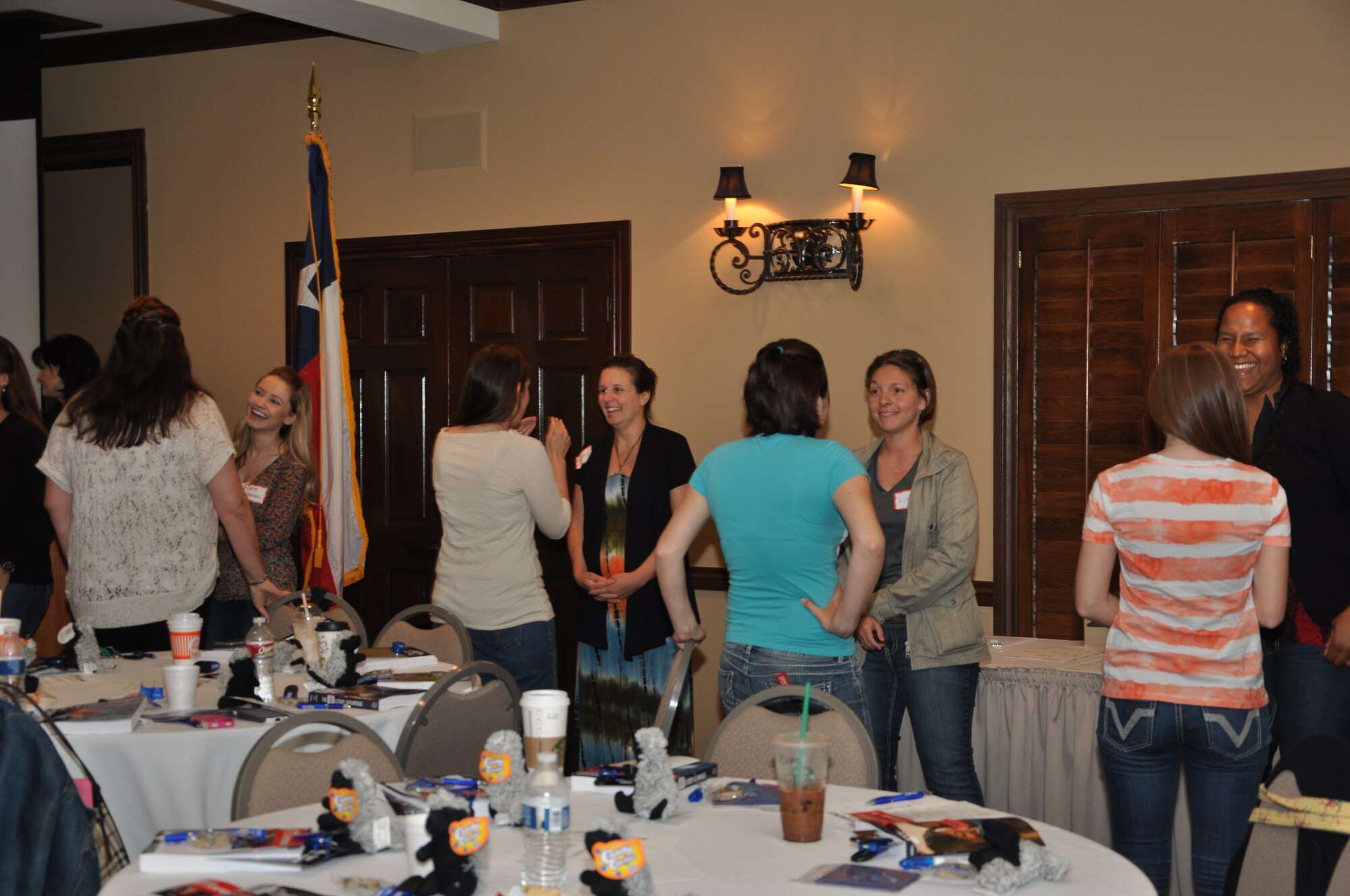 SAN ANGELO, Texas- Military spouses play an interactive game during the Spouse Experience at the LeGrand Alumni and Visitors’ Center of Angelo State University, April 26. The goal of the game was to enhance the spouses’ ability to start conversations and form ever-lasting friendships within their military careers. (U.S. Air Force photo/ Airman 1st Class Erica Rodriguez)

