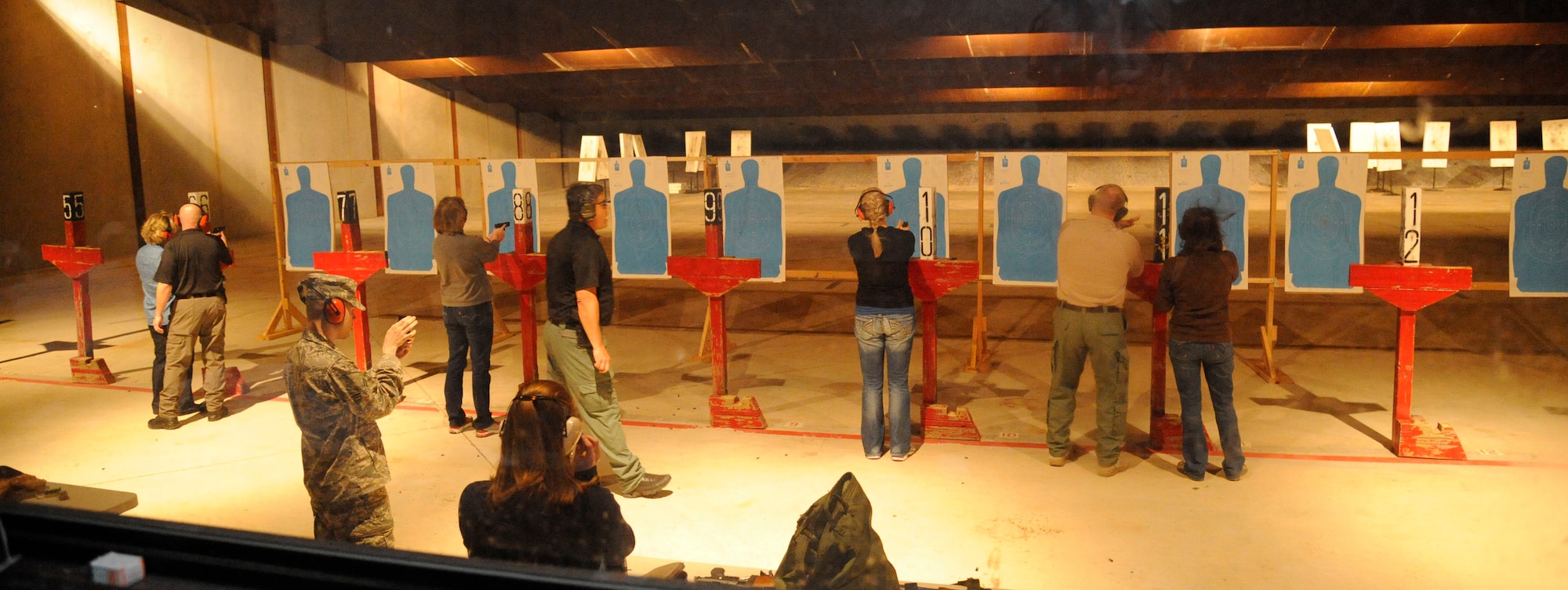 Students of the Women's Introduction to Firearms class fire at the 2nd Security Forces Combat Arms Training and Maintenance range on Barksdale Air Force Base, La., April 26, 2013. The class taught women about various firearms ranging from handguns, shotguns and rifles. (U.S. Air Force photo/Airman 1st Class Andrew Moua)