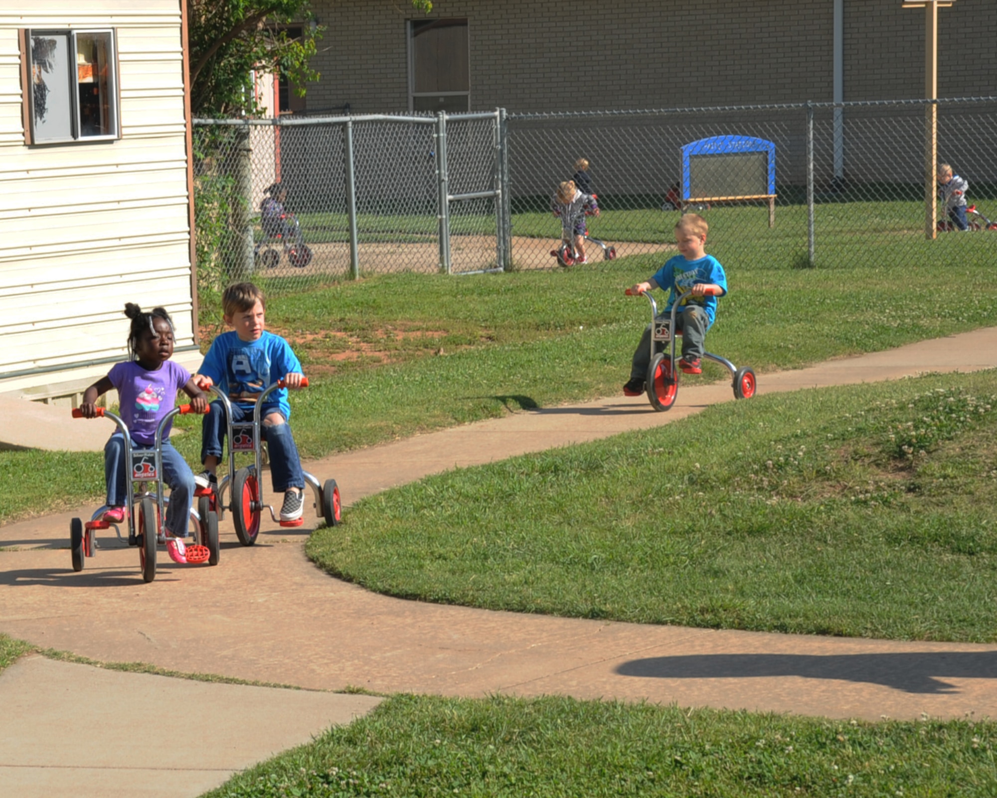 Children at the Child Development Center participate in the annual St Jude Trike-A-Thon on Barksdale Air Force Base, La., April 24, 2013. The event teaches children about riding-toy safety while also raising money for St. Jude Children's Research Hospital. The CDC raises about $1,500 each year for St. Jude.(U.S. Air Force photo/Senior Airman Sean Martin)