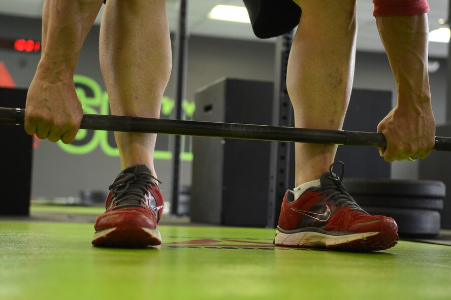 Garris Gonce, local gym co-owner, demonstrates a clean lift, Sumter, S.C., April 27, 2013.  .  A workout named "The Mano," was held to commemorate the life of Capt. James "Mano" Steel, 77th Fighter Squadron pilot, who died as a result of an F-16 Fighting Falcon accident in Afghanistan. (U.S. Air Force photo by Airman 1st Class Nicole Sikorski/Released)