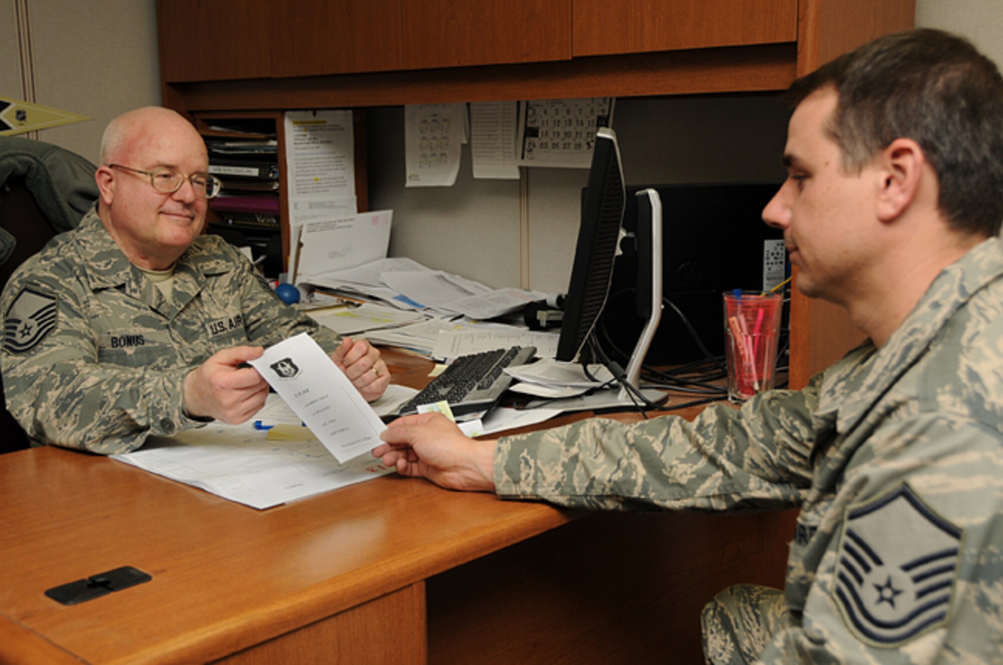 Master Sgt. Gary Bonus, 911th Force Support Squadron education technician and Community College of the Air Force advisor, assists a 911th Airlift Wing Airman with information on obtaining an associate degree through the CCAF program, April 6, 2013. Completing a CCAF associate degree will soon become mandatory for promotion to the grades of E-8 and E-9. For more information about the CCAF program please go to www.au.af.mil/au/ccaf or contact the education office located at building 316, room 104. (U.S. Air Force photo by Senior Airman Joshua J. Seybert/Released)                                 