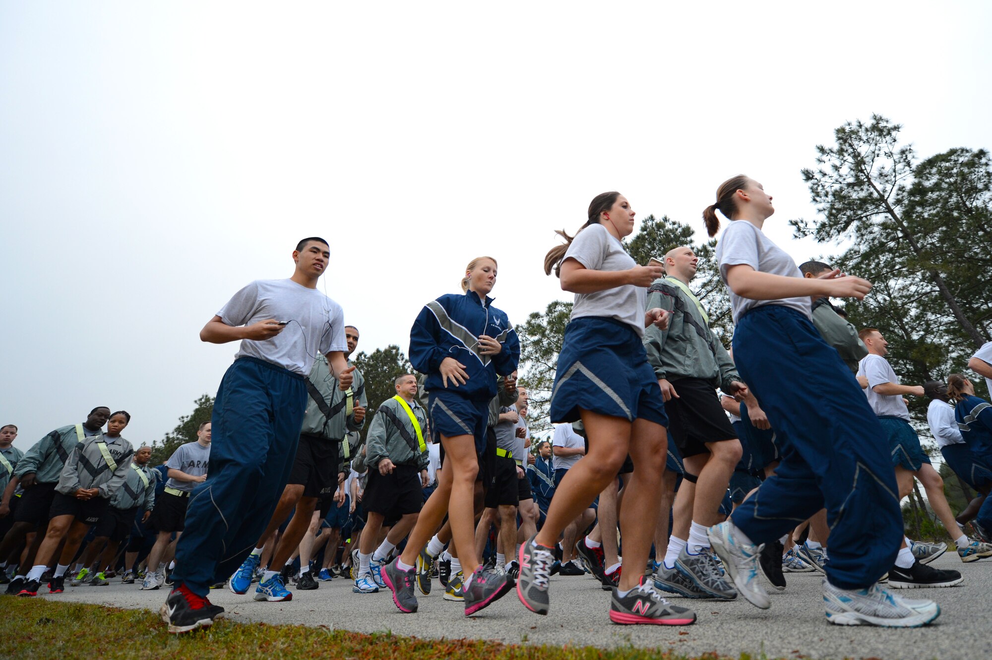 Airmen, Soldiers and dependents take off from the starting line during a sexual assault prevention run at the Shaw Fitness Center Annex, Shaw Air Force Base, S.C., April 26, 2013.  The three-mile run had more than 300 participants and kicked off the 20th Fighter Wing’s Comprehensive Airmen Fitness Day.  (U.S. Air Force photo by Airman 1st Class Nicole Sikorski/Released)