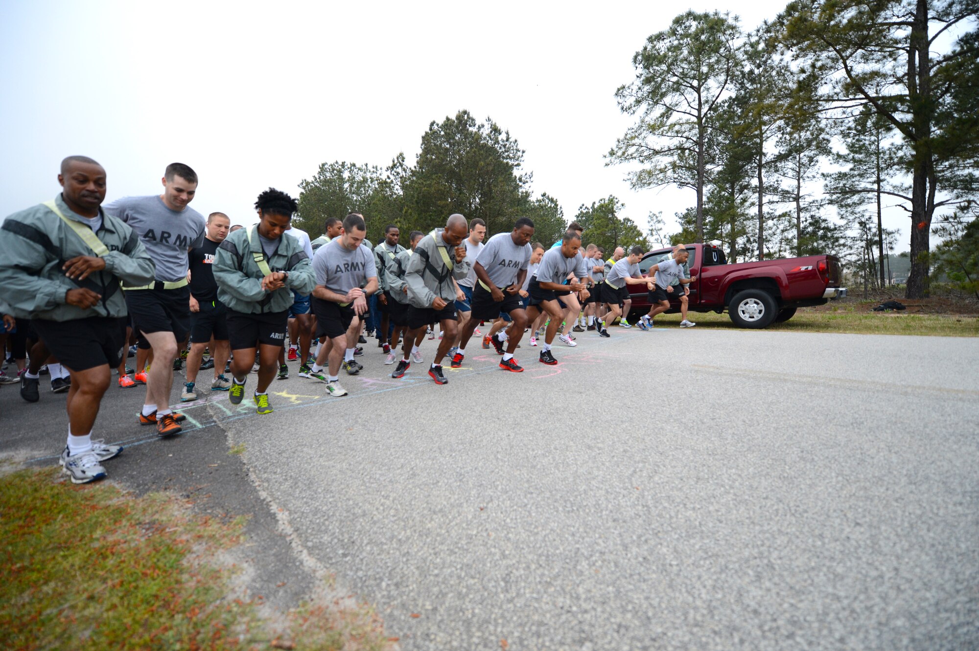 Airmen, Soldiers and dependents run to promote sexual assault prevention at the Shaw Fitness Center Annex, Shaw Air Force Base, S.C., April 26, 2013.  The three-mile run had more than 300 participants and kicked off the 20th Fighter Wing’s Comprehensive Airmen Fitness Day.  (U.S. Air Force photo by Airman 1st Class Nicole Sikorski/Released)