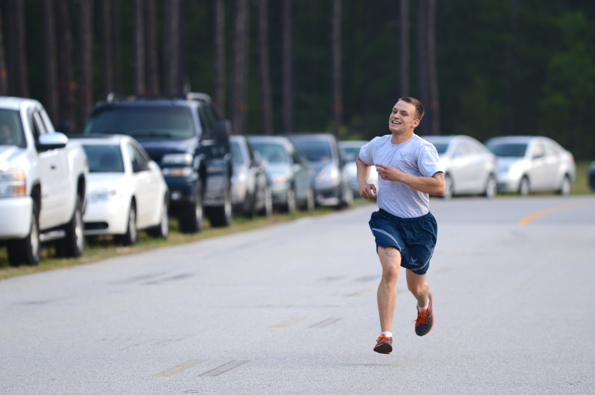 Senior Airman Kevin Dobson, 20th Civil Engineer Squadron, heating, ventilation and air-conditioning technician, finishes first during a sexual assault prevention run at the Fitness Center Annex, Shaw Air Force Base, S.C., April 26, 2013.  The three-mile run had more than 300 participants and kicked off the 20th Fighter Wing’s Comprehensive Airmen Fitness Day.  (U.S. Air Force photo by Airman 1st Class Nicole Sikorski/Released)