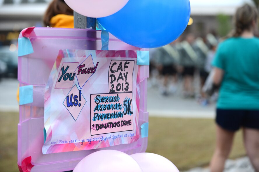 A sign and balloons are tied to a street sign during a sexual assault prevention run at the Shaw Fitness Center Annex, Shaw Air Force Base, S.C., April 26, 2013.  The three-mile run had more than 300 participants and kicked off the 20th Fighter Wing’s Comprehensive Airmen Fitness Day.  (U.S. Air Force photo by Airman 1st Class Nicole Sikorski/Released)
