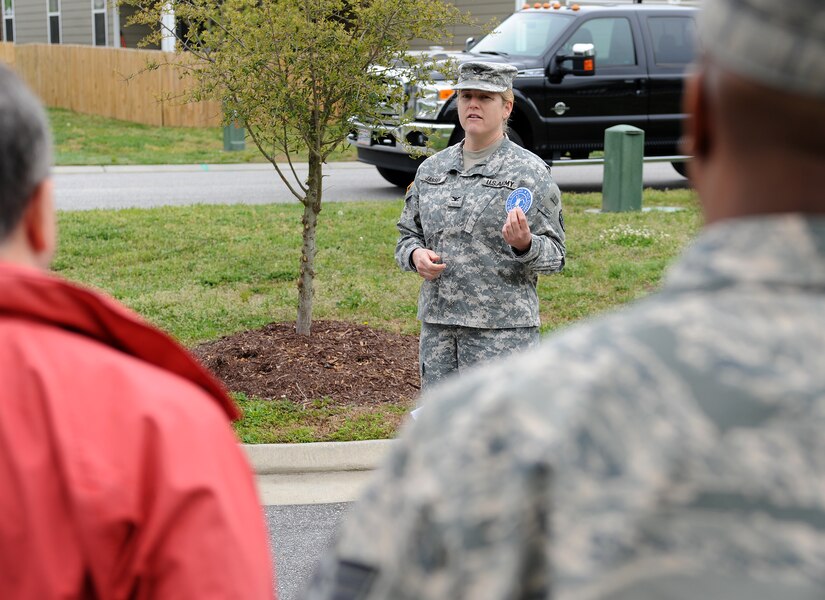 U.S. Army Col. Jayne V. Jansen, 633rd Air Base Wing vice commander, speaks about the importance of keeping storm drains clean in Bethel Manor’s Jamestown Village, Va., April 24, 2013. Jansen, along with members of the 633rd Civil Engineer Squadron, installed medallions for Earth Week above storm drains to warn residents that the drains do not have filters, and that anything that goes down the drains could end up in the local waterways. (U.S. Air Force photo by Senior Airman Teresa Aber/Released)