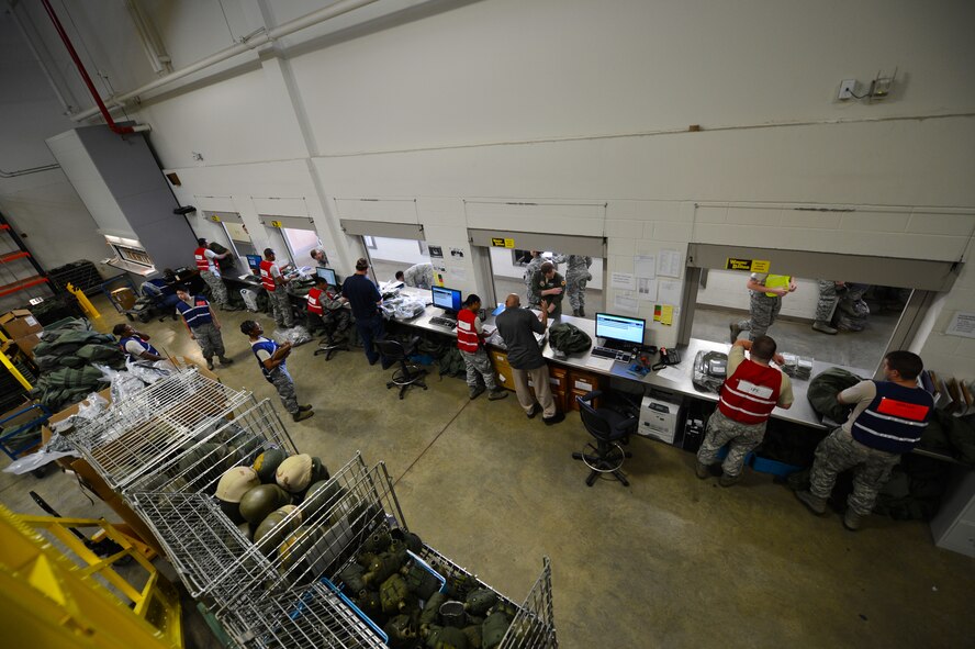 U.S. Air Force Airmen assigned to the 20th Logistics Readiness Squadron process the line at the Deployment Processing Center, Shaw Air Force Base, S.C., April 11, 2013. The 20th LRS Airmen prepared the 55th Fighter Squadron for a deployment to Southeast Asia. (U.S. Air Force photo by Airman 1st Class Nicole Sikorski/Released)