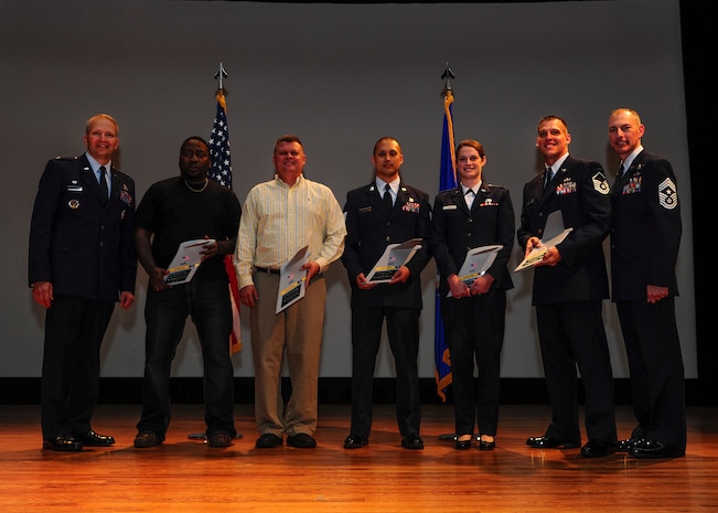 Col. Darren Hartford, 437th Airlift Wing commander (left), and Chief Master Sgt. Larry Williams, 437th AW command chief (right), gather with the 437th AW First Quarter Award winners after a ceremony at the Base Ttheater, April 25, 2013, at Joint Base Charleston - Air Base, S.C. (left to right) Julius Murray, 437th Aerial Port Squadron, Civilian of the Quarter Category I; John Speaks, 315th Aeromedical Evacuation Squadron, Civilian of the Quarter Category II; Tech. Sgt. James Davis Jr., 437th Aircraft Maintenance Squadron, Noncommissioned Officer of the Quarter; 1st Lt. Erin Hughes, 437th AXMS, Company Grade Officer of the Quarter; Master Sgt. Charles Hall, 437th Operations Support Squadron, Senior Noncommissioned Officer of the Quarter. Not pictured is Airman 1st Class Kody Young, 14th Airlift Squadron, Airman of the Quarter. (U.S. Air Force photo/Staff Sgt. Rasheen Douglas)