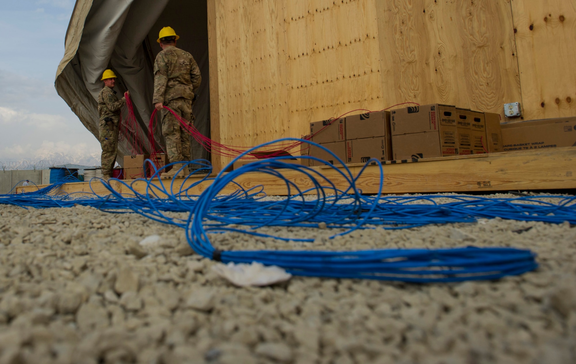 Air National Guard members of the 160th Theater Signal Support Brigade, prepare to install telephone and computer cable at a special forces joint operation center, March 19, 2013, at Bagram Airfield, Afghanistan. The ANG Engineering & Installation Team is deployed from the 205th & 219th Engineering Installation Squadrons, Tulsa and Oklahoma City, Oklahoma.  (U.S. Air Force photo by Staff Sgt. Marleah Miller)