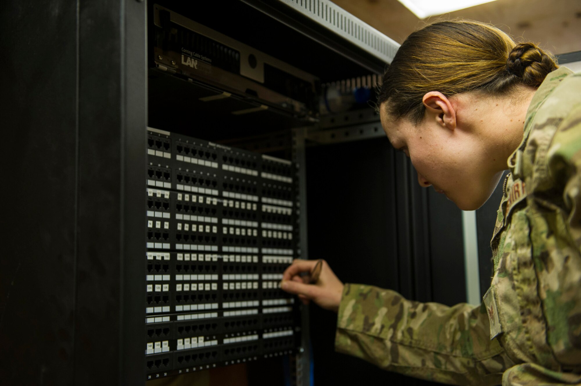 U.S. Air Force Senior Airman Tarah White, 160th Theater Signal Support Brigade airfield systems journeyman, labels a patch panel, March 19, 2013, at Bagram Airfield, Afghanistan. White is a member of an Air National Guard Engineering & Installation Team deployed from the 219th Engineering Installation Squadron, Tulsa, Oklahoma. White is a native of Greeley, Colorado. (U.S. Air Force photo by Staff Sgt. Marleah Miller)