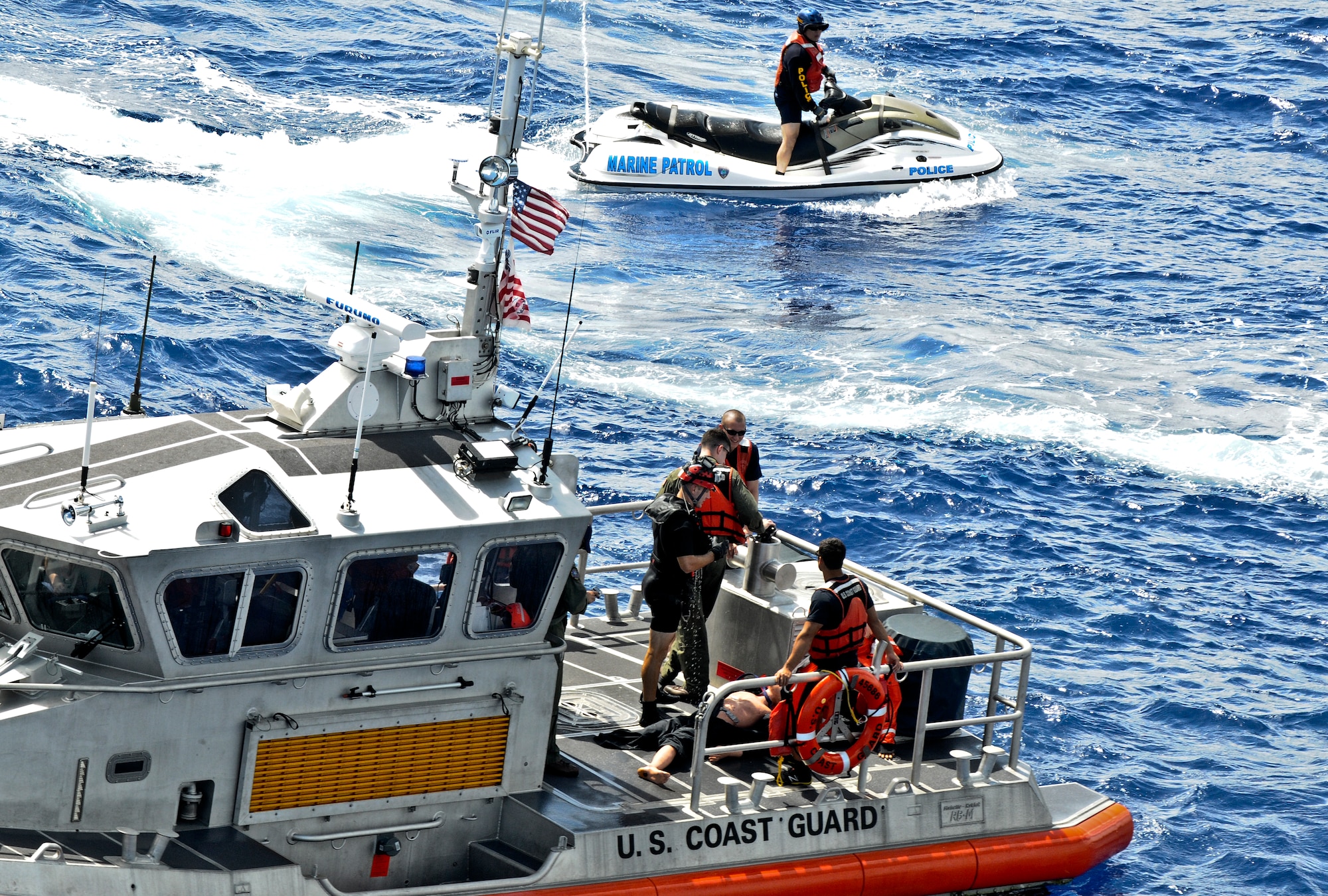 First responders from the military and community of Guam participate in joint water rescue training near Sirena Beach on Andersen Air Force Base, Guam, April 25, 2013. 