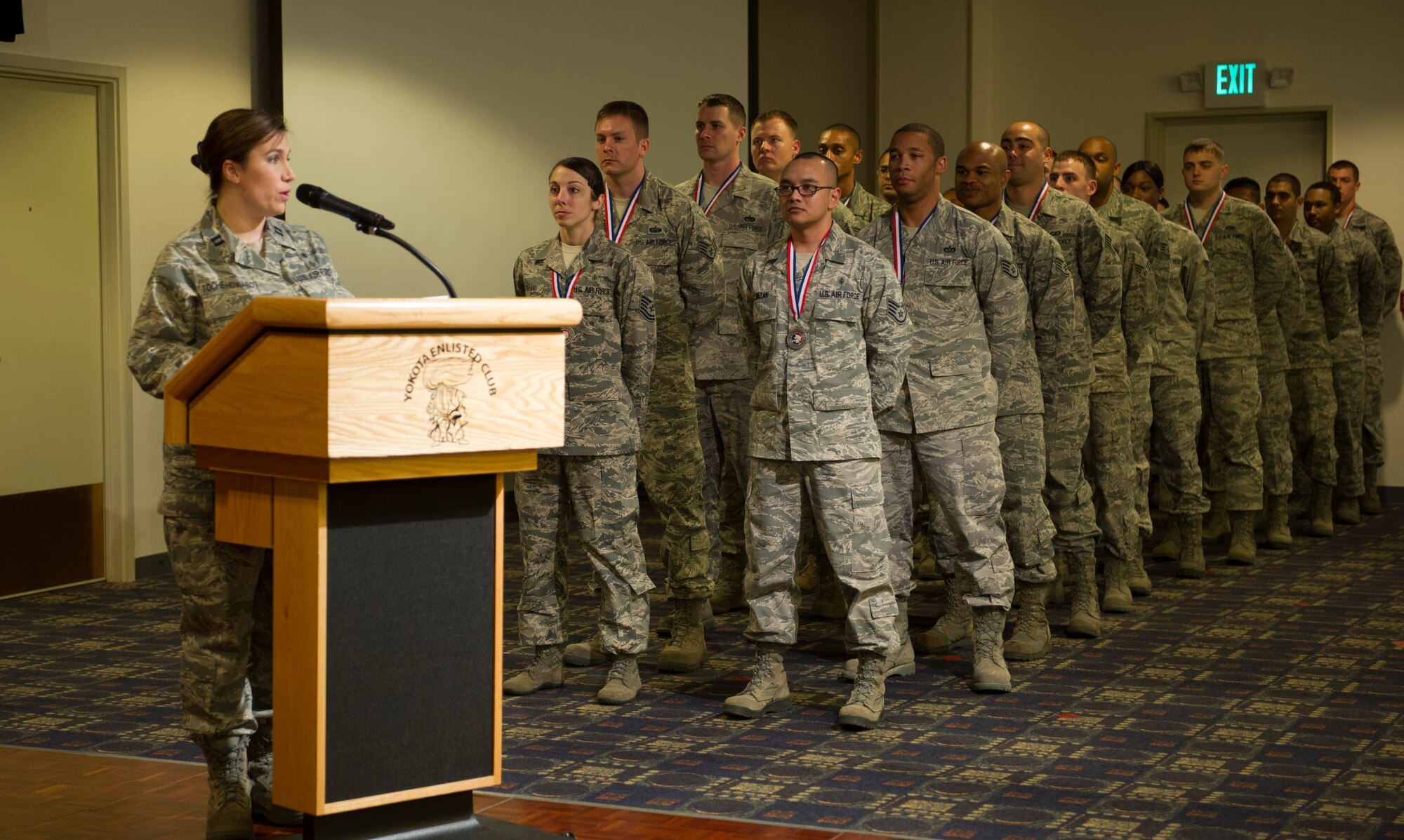 YOKOTA AIR BASE, Japan -- Past and present Yokota honor guard members wait in line to be recognized by wing leadership during the 2013 Honor Guard Recognition Banquet at Yokota Air Base, Japan, April 26, 2013. Honor guard members were formally recognized with a certificate, lunch speech, and drill performance by Yokota High School's Junior Reserve Officer Training Corps and Civil Air Patrol members.  (U.S. Air Force photo by Senior Airman Andrea Salazar/Released)