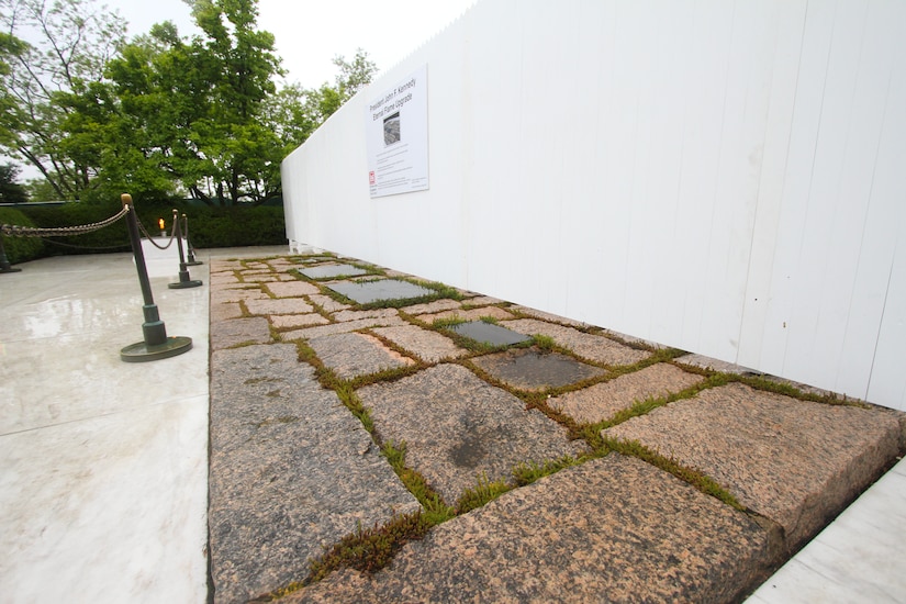 ARLINGTON, Va. –A white fence temporarily shields the public’s view of the John F. Kennedy Eternal Flame at Arlington National Cemetery April 29, 2013. The flame, which is undergoing repair and upgrade work, will receive new burners, a new igniter as well as new gas and air lines. Work on the burner itself will take about three weeks to complete. (U.S. Army photo/Patrick Bloodgood)