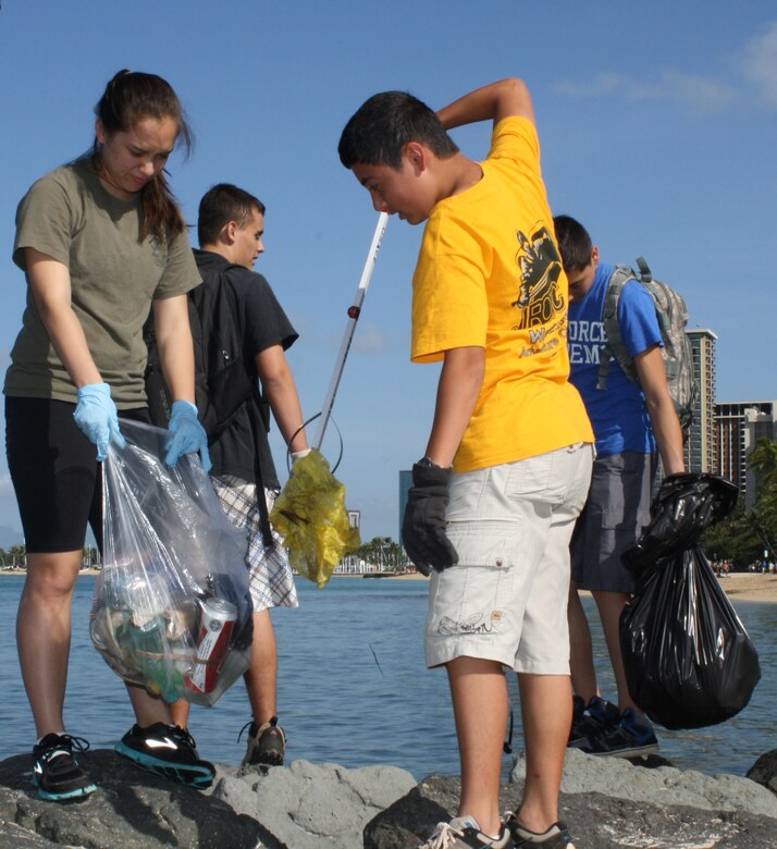 Volunteers from the U.S. Army Corps of Engineers partnered with the Waikiki Improvement Association, the Hale Koa Hotel and other concerned citizens to participate in the Waikiki Beach Clean-up on April 27 as part of Earth Day 2013.  Approximately 20 volunteers from the Punahou Junior ROTC program (which includes cadets from other area high schools and some home-schooled students) and Corps’ employees and family members joined forces to clean up the beach and berm area and plant decorative plants donated by the Hale Koa Hotel at the Corps’ Pacific Regional Visitor Center (RVC) at Fort DeRussy in Waikiki.  Altogether about 50 volunteers participated.  The RVC is located on the second floor of historic Battery Randolph at Fort DeRussy. Battery Randolph is listed on the National Register of Historic Sites and is one of 16 coastal fortifications built by the Corps between 1906 and 1917 for the protection of Honolulu and Pearl Harbors.