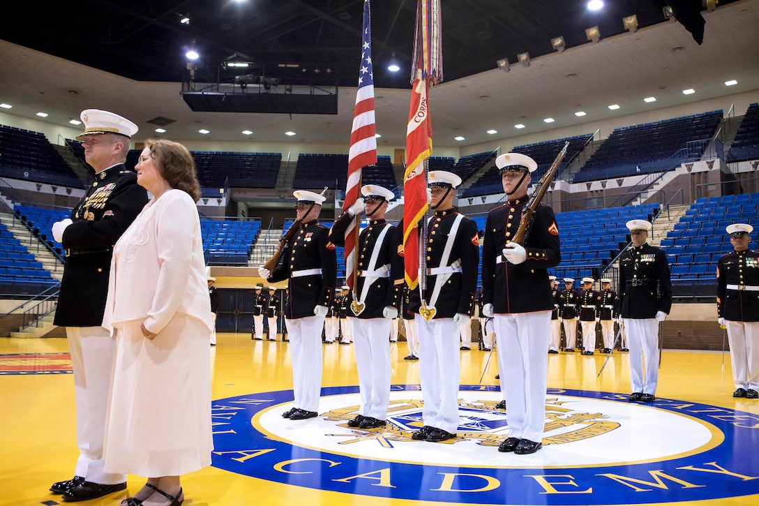 Marine Corps Gen. John R. Allen, left, and his wife, Kathy, stand in front of the Marine Corps Color Guard during Allen's retirement ceremony at the U.S. Naval Academy in Annapolis, Md., April 29, 2013.