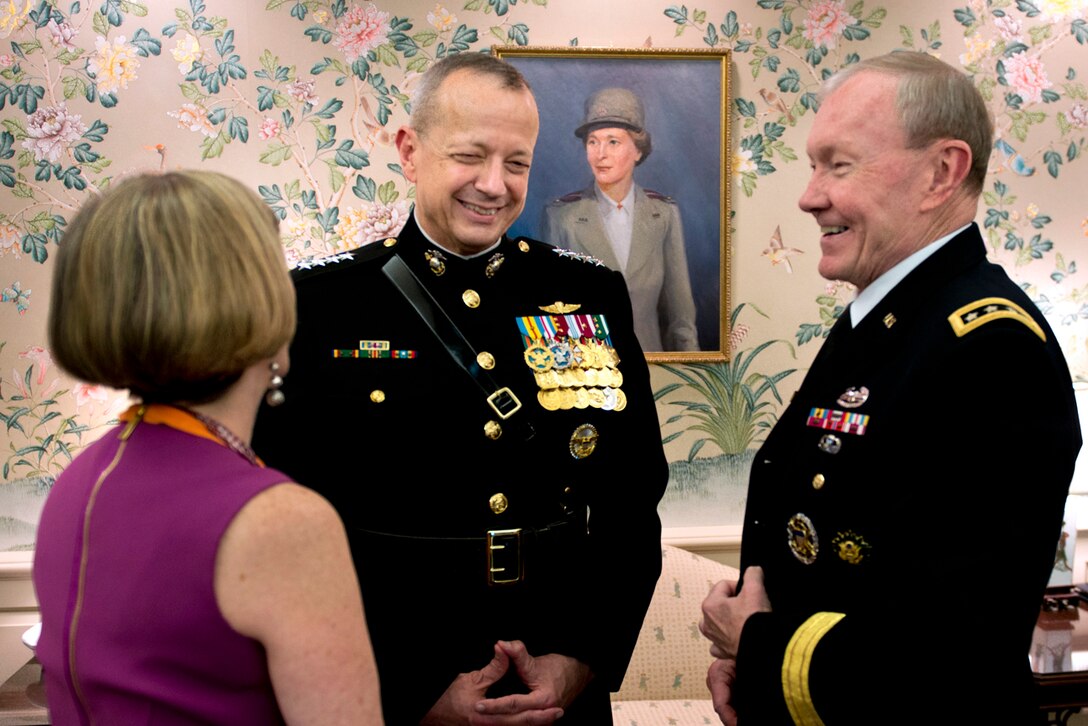Marine Corps Gen. John R. Allen, center, Army Gen. Martin E. Dempsey, chairman of the Joint Chiefs of Staff, right, and and his wife, Deanie, share a moment before Allen's retirement ceremony at the U.S. Naval Academy in Annapolis, Md., April 29, 2013.