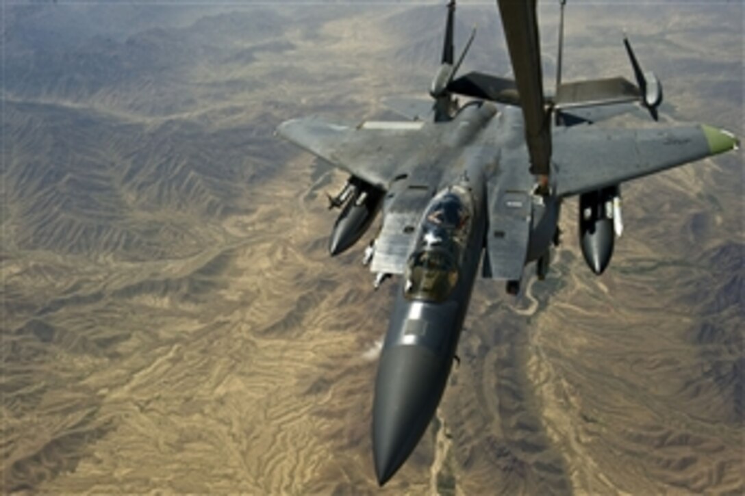 A U.S. Air Force F-15E Strike Eagle is refueled by an Air Force KC-10 Extender over Southwest Asia on April 1, 2013.  The Strike Eagle is deployed from Royal Air Force Lakenheath, England, while the tanker is deployed from Travis Air Force Base, Calif.  The aircraft are conducting missions in support of Operation Enduring Freedom.  