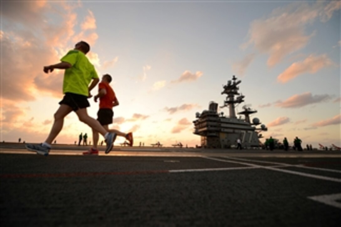 Crewmen on the aircraft carrier USS George H.W. Bush (CVN 77) run on the flight deck for exercise as the ship operates in the Atlantic Ocean on April 26, 2013.  Bush is underway to conduct training operations in the Atlantic.  