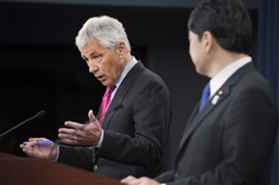 Secretary of Defense Chuck Hagel, left, answers a reporter’s question during a joint press conference with Japan's Minister of Defense Itsunori Onodera in the Pentagon on April 29, 2013.  Hagel and Onodera briefed the press on the substance of their earlier meeting where they discussed U.S.-Japanese security concerns.  
