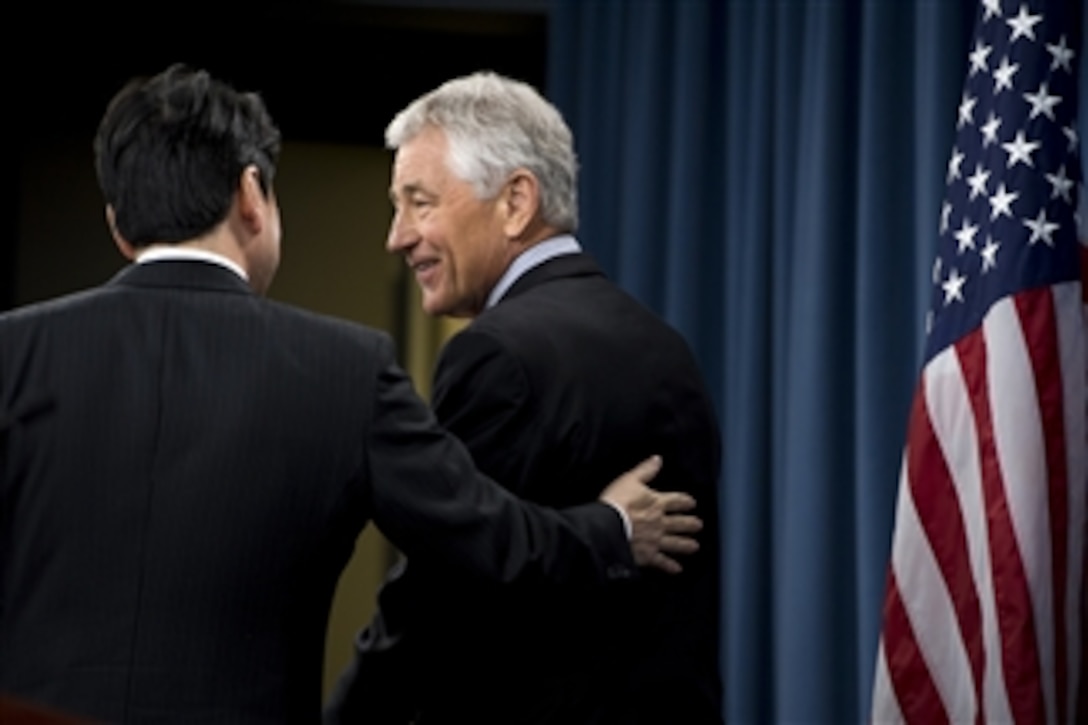 Secretary of Defense Chuck Hagel, right, and Japan's Minister of Defense Itsunori Onodera leave the Pentagon Press Briefing Room after their joint press conference on April 29, 2013.  Hagel and Onodera briefed the press on the substance of their earlier meeting where they discussed U.S.-Japanese security concerns.  